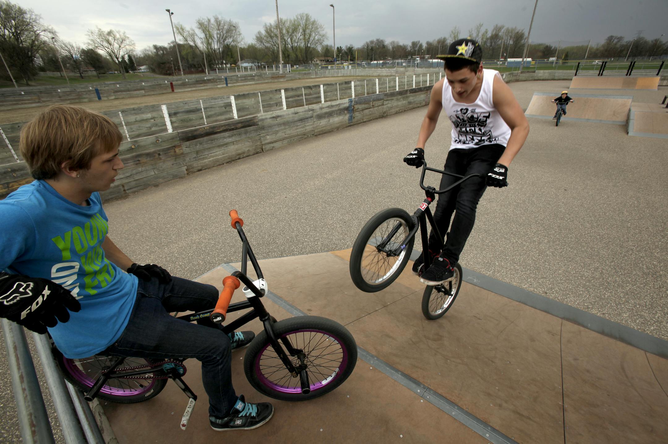 Derick Sullins, 15 years old (blue shirt), Damian Holland, 12 years old (black shirt), and Dillon Mota 15 years old (white shirt) of Coon Rapids rode their bikes in the Coon Rapids Sand Creek Park on May 8, 2013. ] JOELKOYAMA‚Ä¢joel koyama@startribune.com MAGIC SAXO NUMBER IS 598788 Coon Rapids is poised to move ahead with a $17 milllion parks referendum this November. The city conducted a survey to gauge interest. Council to vote on May 7. If passed by voters, a $17 million par