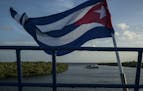 The Cuban flag on the deck of a floating hotel in Jardines de la Reina, a protected area south of Jucaro, Cuba.