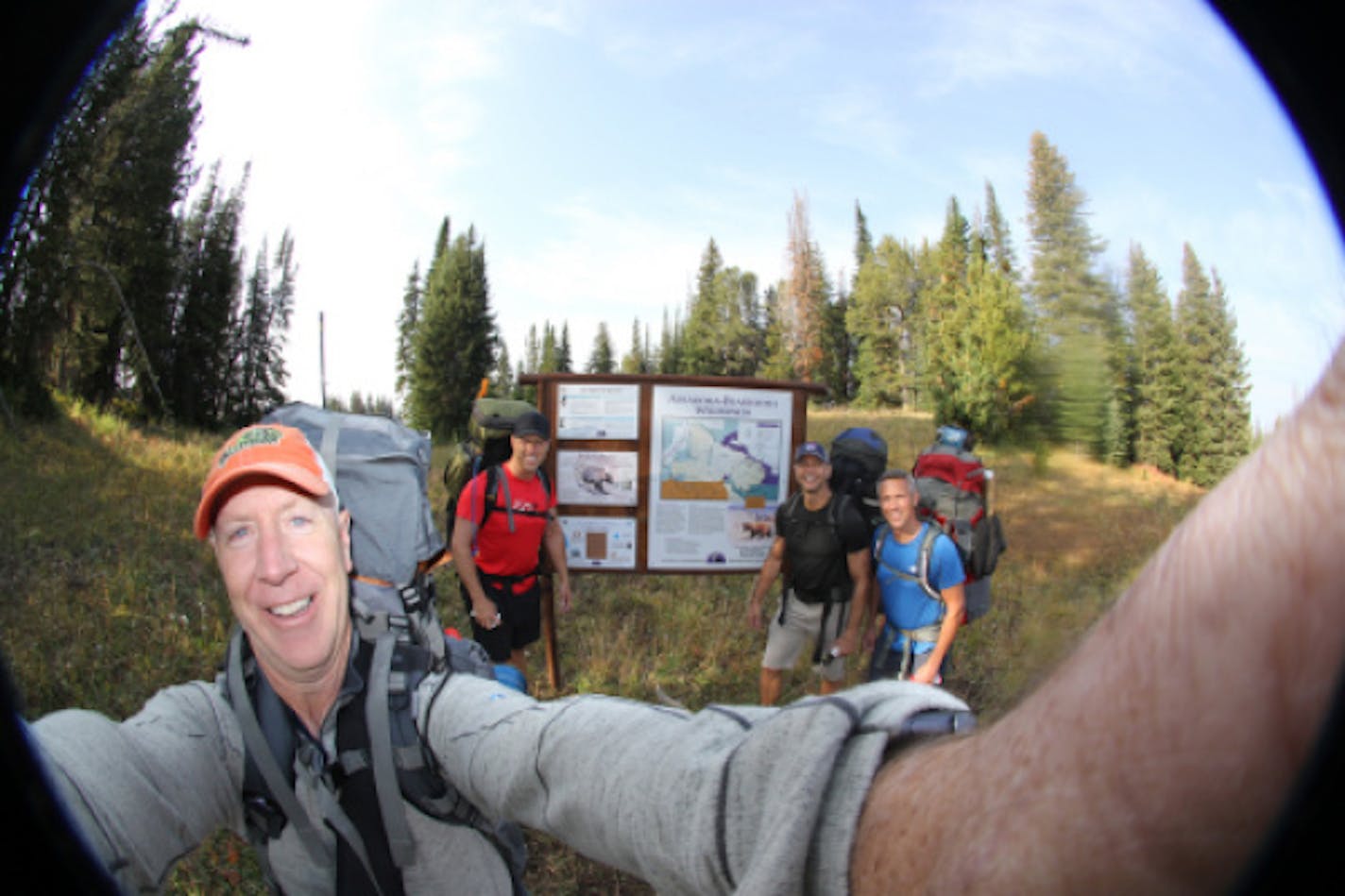 Friends, including Brad Johnson, far right, on the first day of their hike Sunday in the Beartooth Mountains. From left, Todd Green, Tom Therrien and Justin Reid.