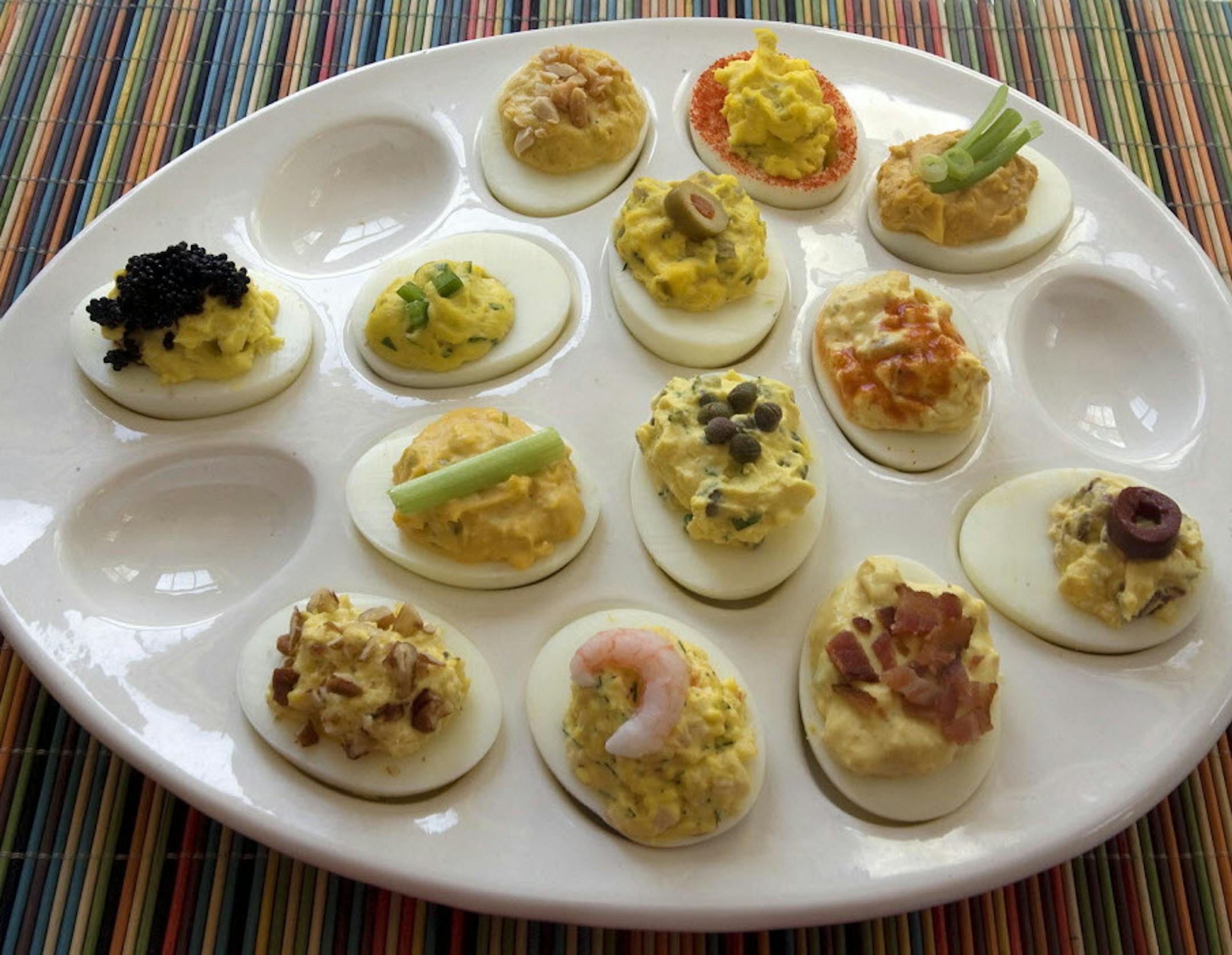 SH11D146DEVILEDEGGS April 26, 2011 - Dress up deviled eggs with ingredients that go beyond traditional mayonnaise and paprika. (SHNS photo by Scott Keeler / St. Petersburg Times)