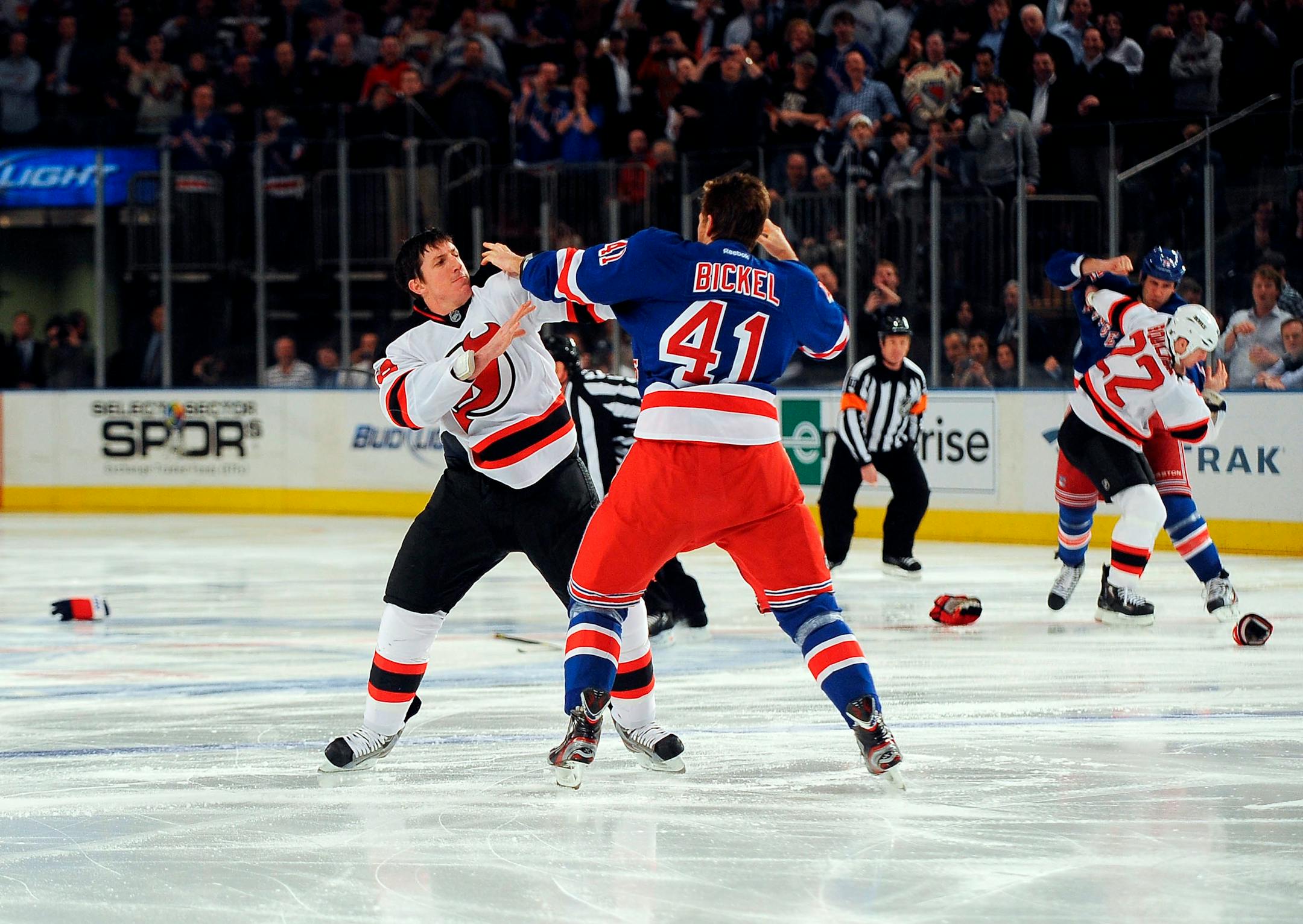 FILE -- From left: Brandon Prust and Cam Janssen, Ryan Carter and Stu Bickel, and Eric Boulton and Mike Rupp fight at the start an NHL hockey game between the New York Rangers and the New Jersey Devils at Madison Square Garden in New York, March 19, 2012. The Rangers and the Devils split their six-game season series, but the final scores practically became an afterthought because of spillages of animosity between the players, and even their coaches. (Barton Silverman/The New York Times)
