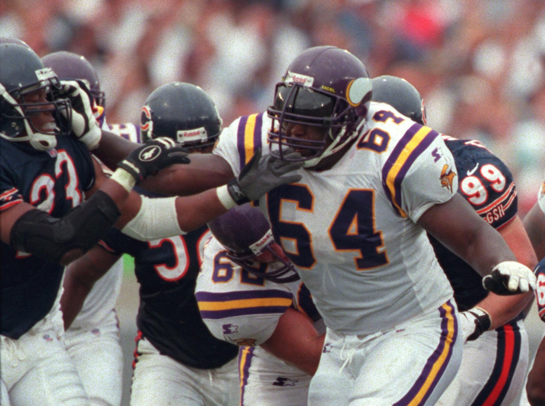 Vikings offensive line Randle McDaniel keeps Marty Carter of the Bears at bay during the game at Chicago.
