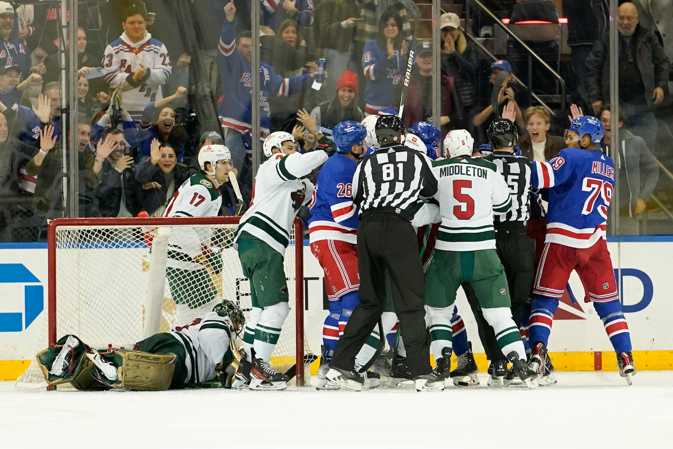 RETRANSMISSION TO CORRECT THAT FILIP CHYTIL SCORED - The New York Rangers fight against the Minnesota Wild after center Filip Chytil scored a goal during the third period of an NHL hockey game, Tuesday, Jan. 10, 2023, at Madison Square Garden in New York. The Rangers won 4-3. (AP Photo/Mary Altaffer)