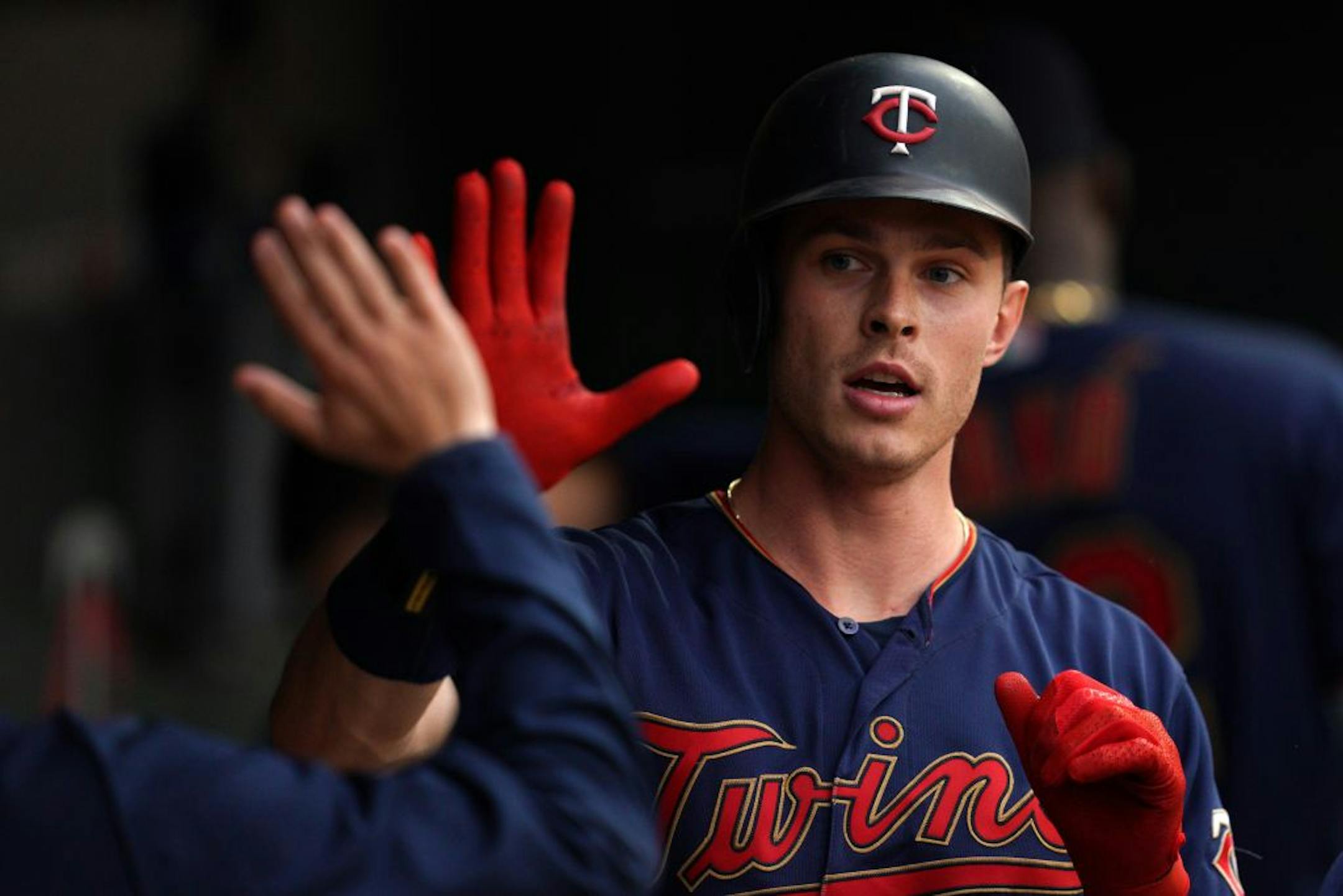 Minnesota Twins right fielder Max Kepler (26) celebrated with his teammates in the dugout after hitting a home run in the fourth inning.