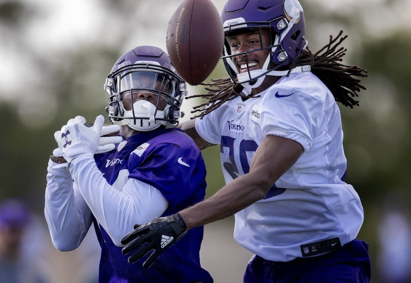 Defensive back Trae Waynes, right, breaks up a pass intended for wide receiver Stefon Diggs during the Minnesota Vikings' afternoon practice session on Thursday, July 27, 2017, in Mankato, Minn.