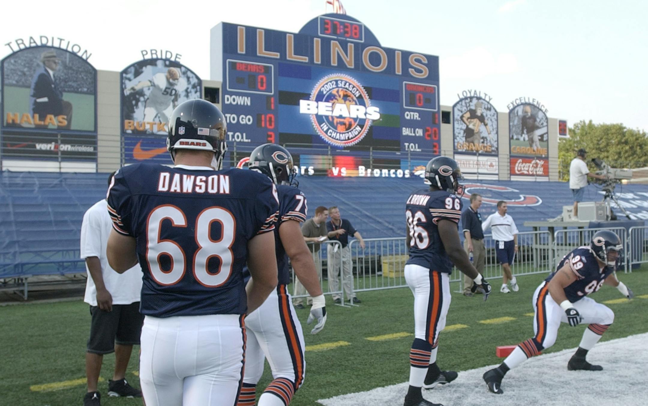 Chicago Bears' Curry Dawson (68), Christian Peter, in front of Dawson, Alex Brown (96) and Joe Tafoya, right, warm up before the Bears' exhibition game against the Denver Broncos at Memorial Stadium, home of the University of Illinois football team, Saturday, Aug. 10, 2002, in Champaign, Ill. The Bears will play all of their home games at the stadium in 2002, while Soldier Field in Chicago undergoes a renovation. (AP Photo/M. Spencer Green) ORG XMIT: CHS102