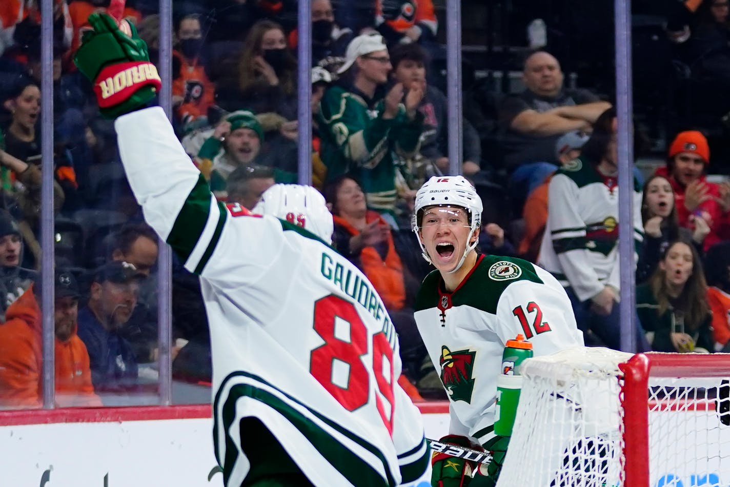 The Wild's Matt Boldy (12) and Frederick Gaudreau celebrate after Boldy's goal during the third period against the Flyers on Thursday