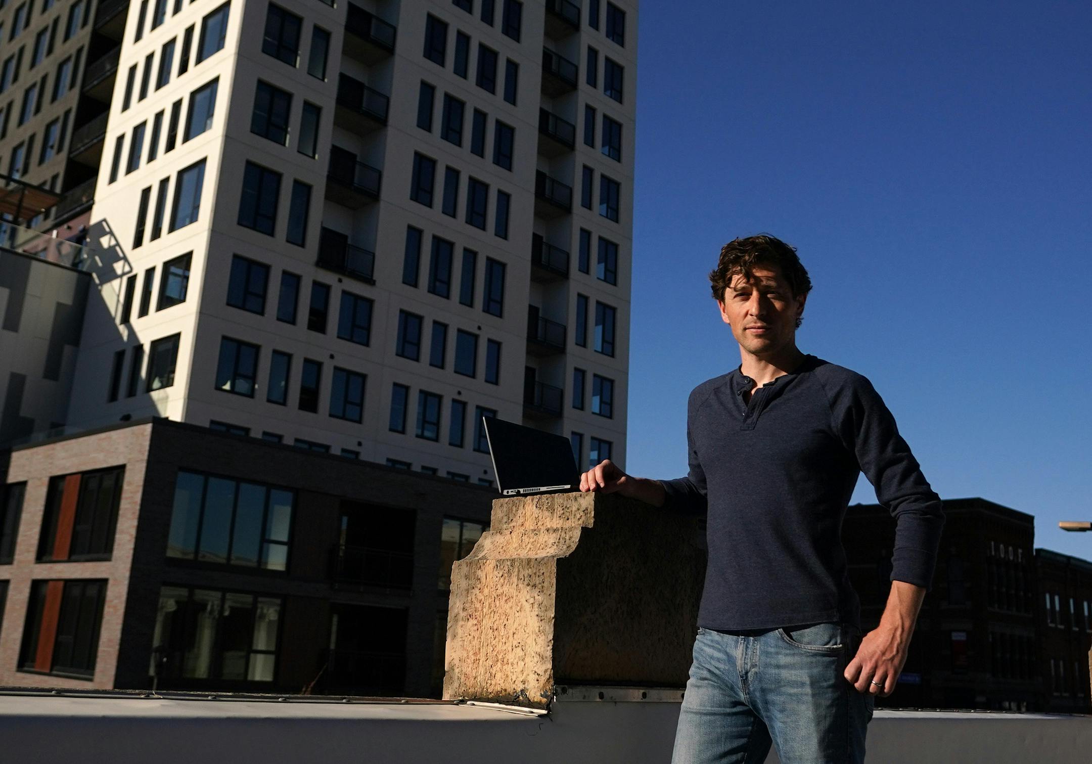 Minneapolis Mayor Jacob Frey stood for a portrait on an adjacent rooftop overlooking Hennepin Avenue where he often goes to work from his laptop. ] ANTHONY SOUFFLE • anthony.souffle@startribune.com Minneapolis Mayor Jacob Frey and his wife, Sarah Clarke, who are navigating the pandemic both personally as they await their first child and professionally as the city shifts to a new way of life during the COVID-19 pandemic, stood for a portrait at their home Thursday, April 30, 2020 in Northe