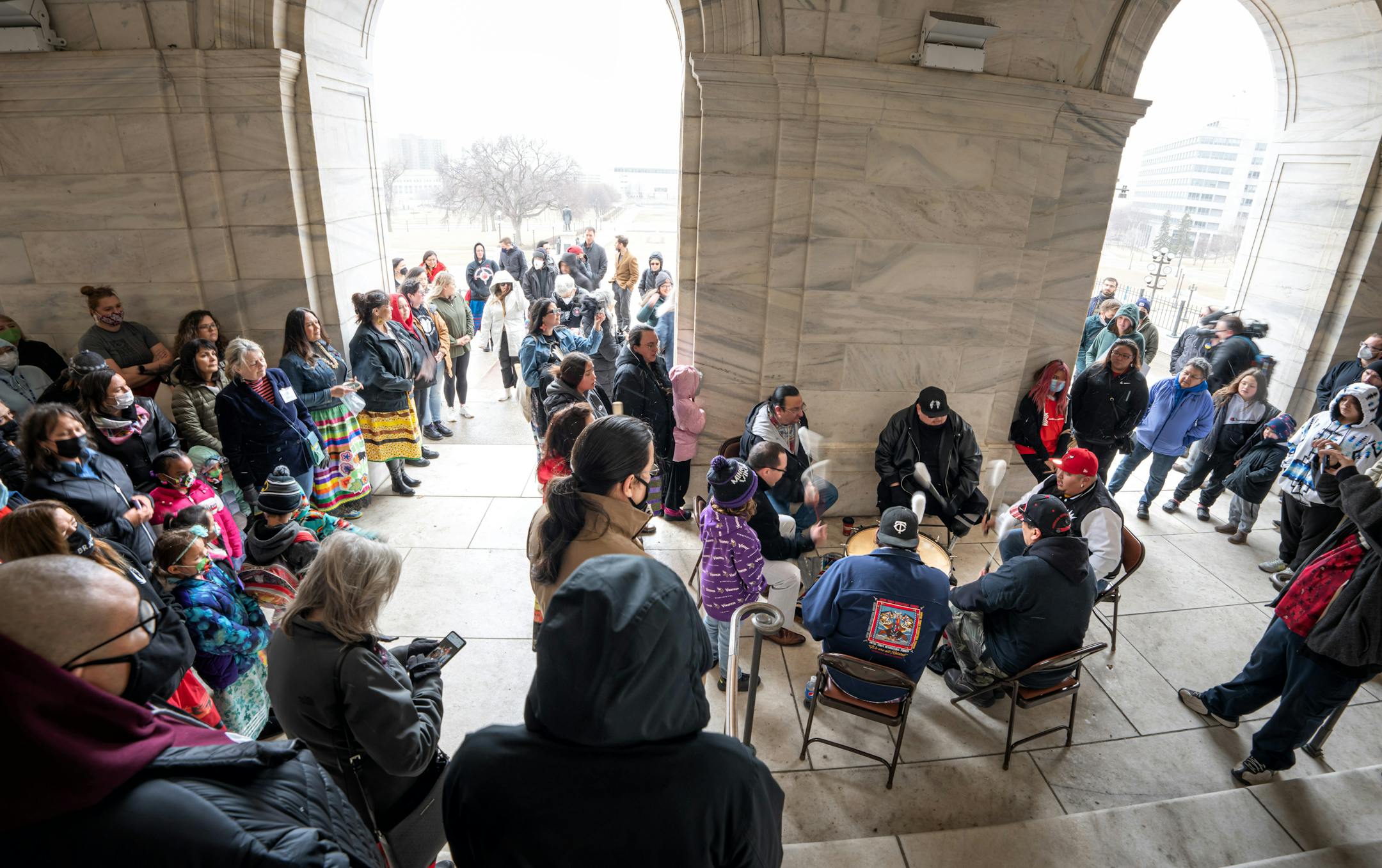 Crow Bellecourt, Clyde Bellecourt's son, led singing by the drum group Midnite Express outside the Capitol before the rally, Friday, March 25, 2022, St. Paul, Minn. Sixteen Twin Cities American Indian organizations held a rally at the Capitol to highlight the Clyde Bellecourt Urban Indigenous Legacy Initiative, a bill to construct 12 new facilities at a cost of $83.9 million, designed to address disparities facing Native Americans in the Twin Cities.