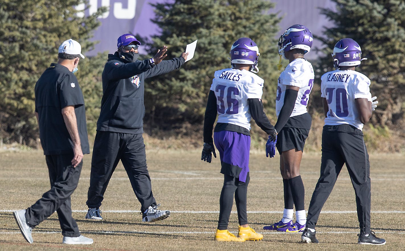 VIkings defensive backs coach Daronte Jones, second from left, took to the field for practice at TCO Performance Center on Thursday