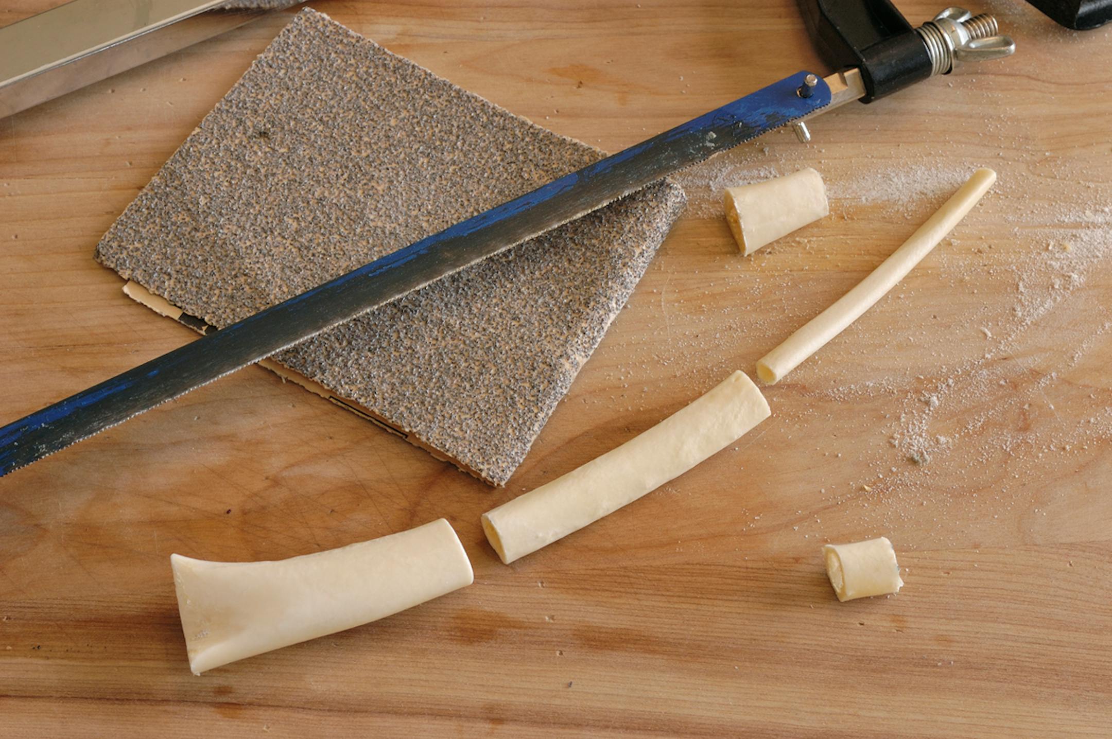 Cut the bones with a hack saw and bevel the ends with sandpaper so they find snuggly together.