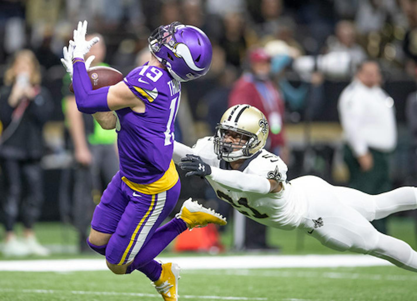 Minnesota Vikings wide receiver Adam Thielen makes a catch over New Orleans Saints defensive back Patrick Robinson in overtime on Sunday, Jan. 5, 2020 at Mercedes-Benz Superdome in New Orleans, La. (Elizabeth Flores/Minneapolis Star Tribune/TNS) ORG XMIT: 1532834