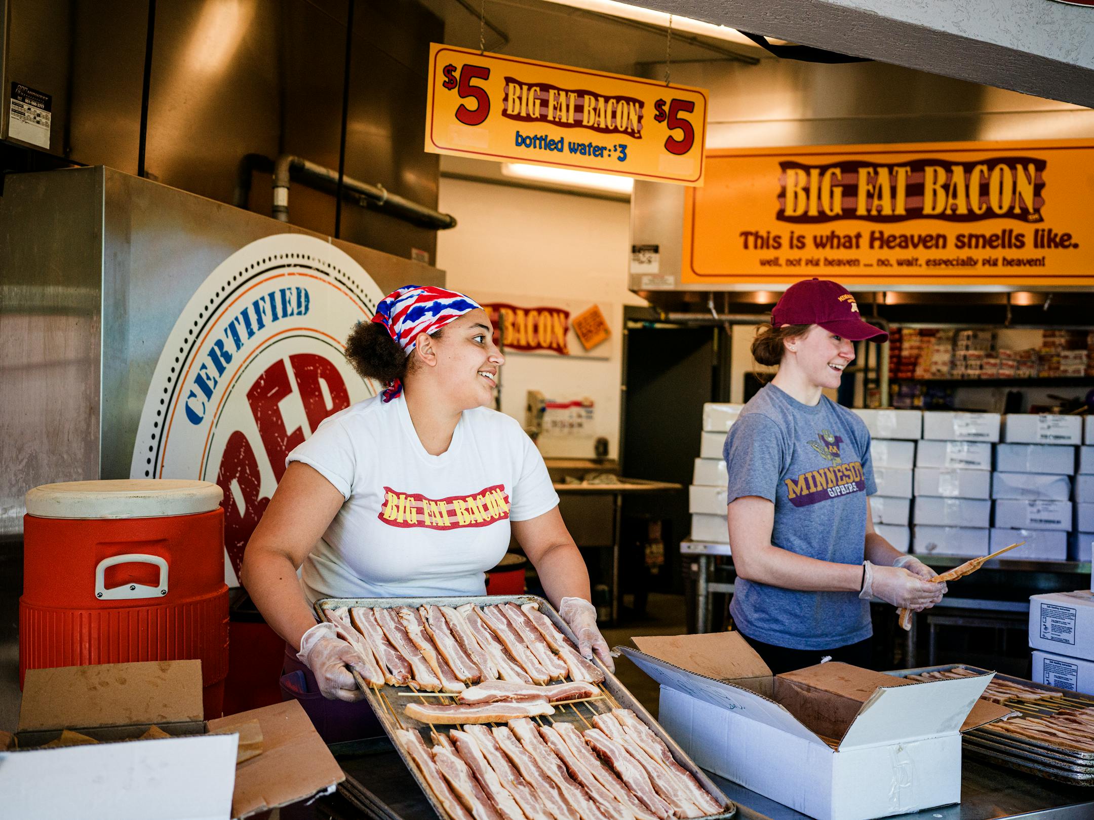 On the Minnesota State Fairgrounds in Falcon Heights, MN on May 26, 2021 Alexana Lofton and Megan Hare get the bacon ready for the big opening tomorrow.] endors getting ready for this weekend's Kickoff to Summer at the Fair" event. It's sort of a preview to the big show set to take place in August. RICHARD TSONG-TAATARII • Richard.Tsong-Taatarii@startribune.com