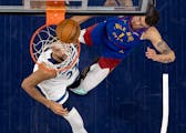 Rudy Gobert (27) of the Minnesota Timberwolves and Michael Porter Jr (1) of the Denver Nuggets during Game 3 of the NBA Western Conference Semi-finals