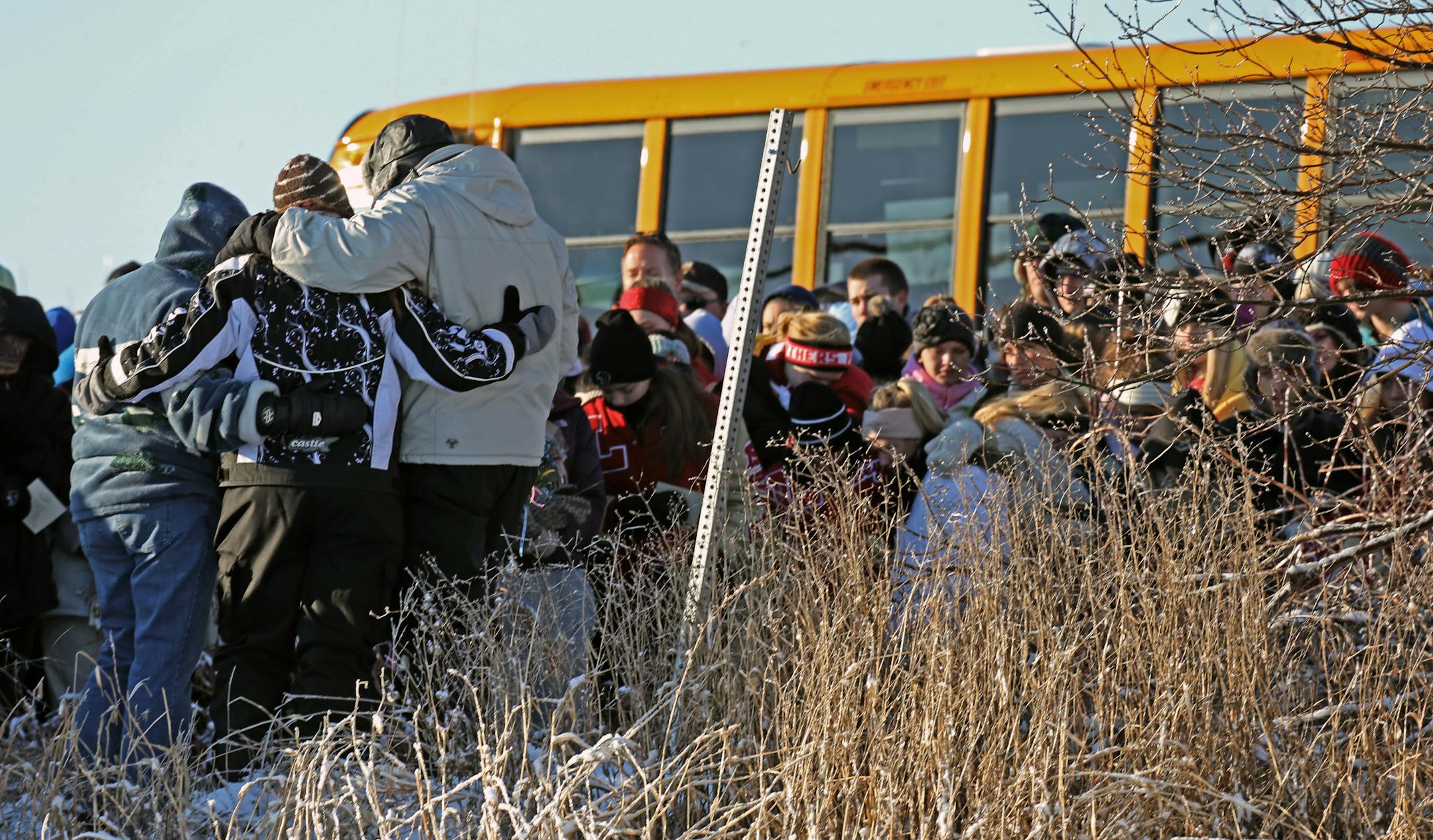 Friends and family gather to mourn the death of Alyssa Ettl. Lakeville police shut down Dodd Boulevard on Dec. 7, 2013, to offer an opportunity for family, friends and students to visit the accident site where Ettl died.