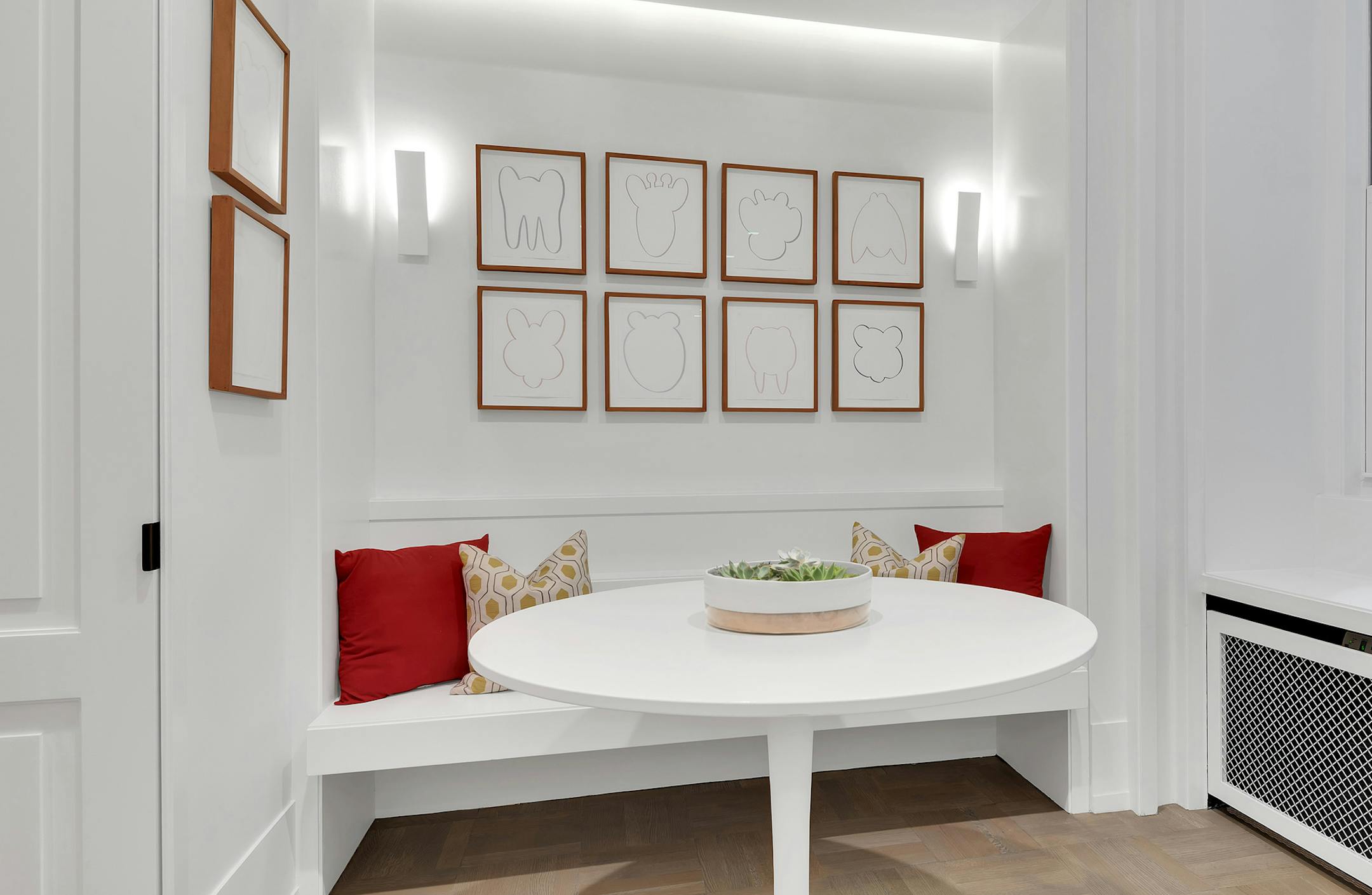 Warm colors help ano otherwise white kitchen area feel cozy. (Design Recipes/TNS)