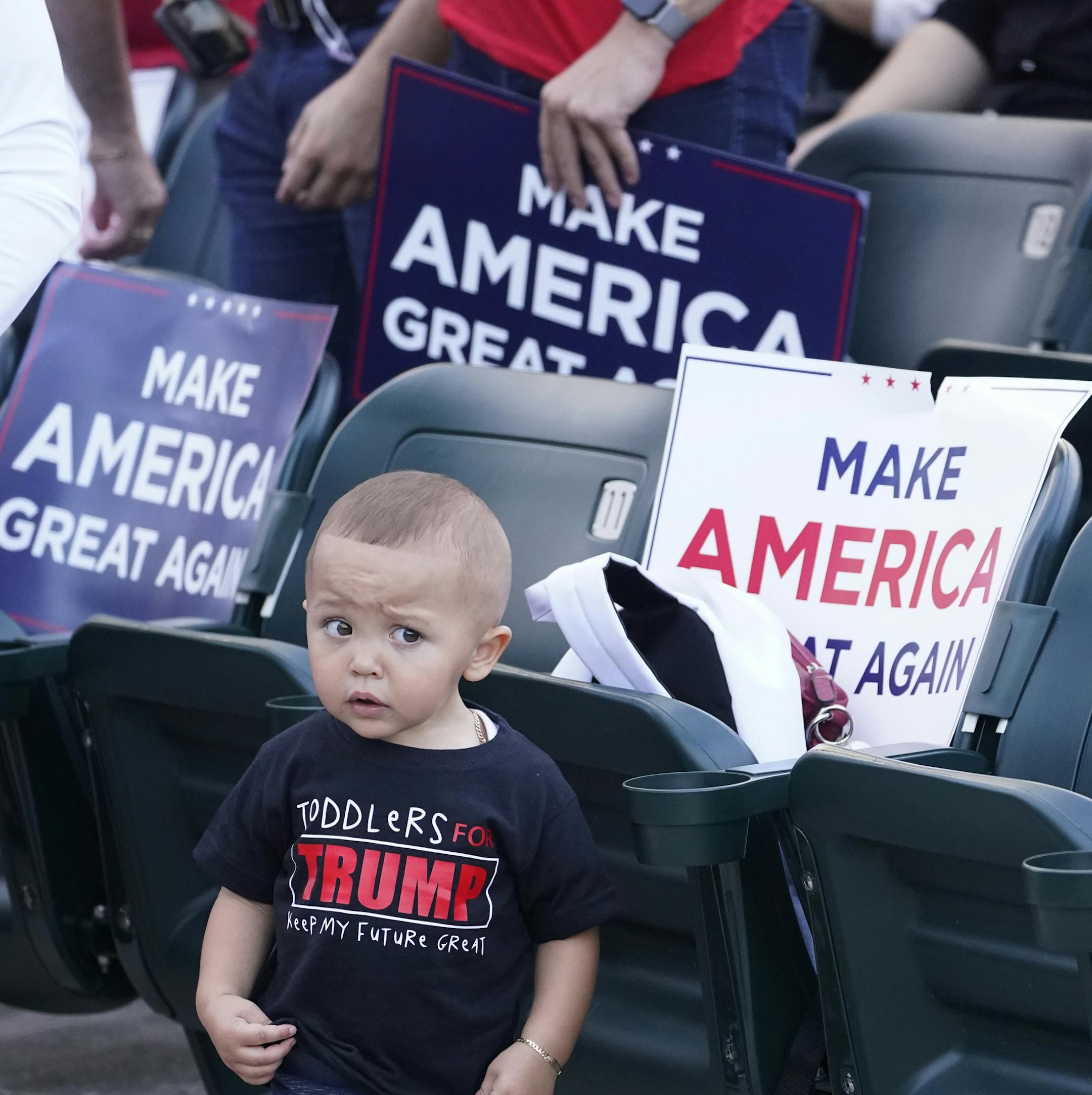 A young boy wearing a "Toddlers for Trump," T-shirt during a campaign event with Ivanka Trump at Bayfront Park Amphitheater, Tuesday, Oct. 27, 2020, in Miami. (AP Photo/Wilfredo Lee)