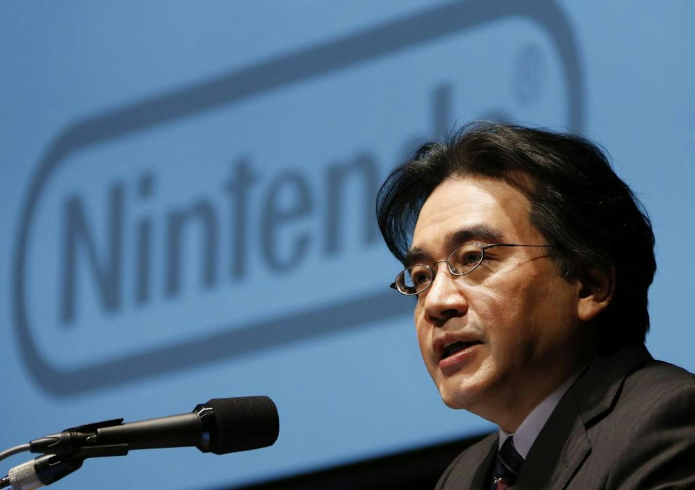 FILE - In this Jan. 31, 2013 file photo, Nintendo Co. President Satoru Iwata speaks during a news conference in Tokyo. Nintendo said President Iwata died Saturday, July 11, 2015, of a bile duct tumor in a Kyoto hospital, western Japan.