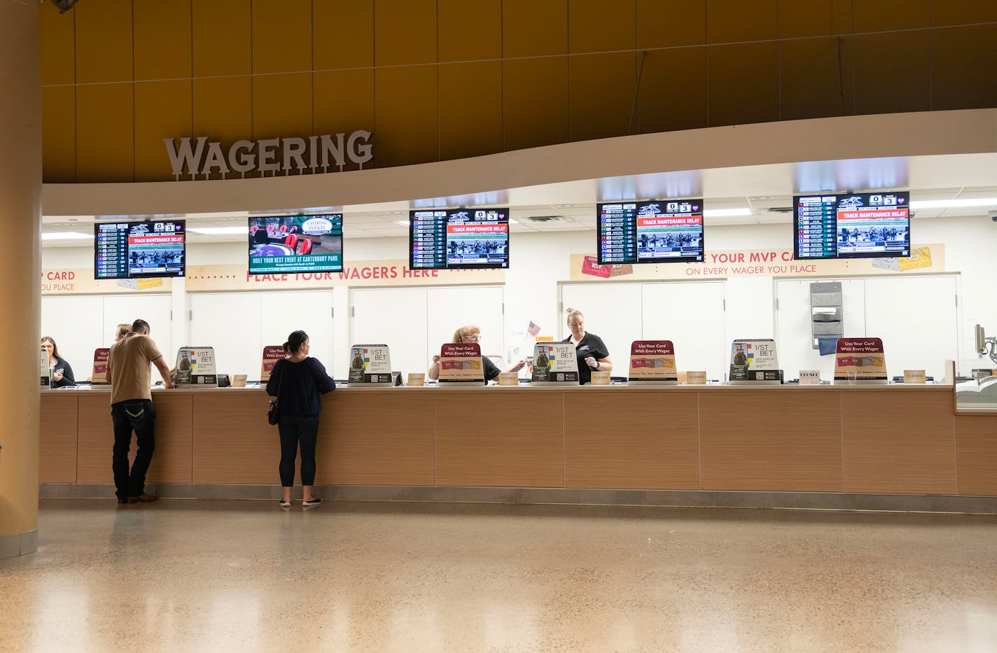 Bettors place wages during the final day of the racing season Saturday, Sep. 16, 2023, at Canterbury Park in Shakopee, Minn. The day was cut short due to unsafe track conditions that caused all races to be cancelled after the third race. ]