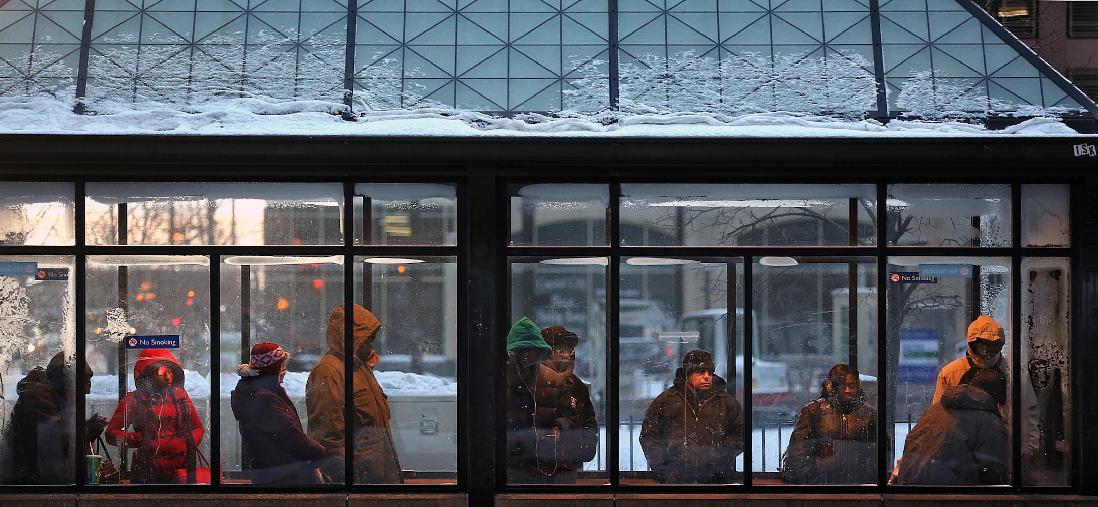 A shelter offered some protection from the bitter-cold temperatures Tuesday morning as people waited for a bus on the corner of 5th and Minnesota Streets in St. Paul. ] JIM GEHRZ &#x201a;&#xc4;&#xa2; jgehrz@startribune.com / St. Paul, MN / January 7, 2014 / 8:30 AM