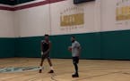 Here's Jimmy Butler, still in Minneapolis, getting heckled while shooting hoops