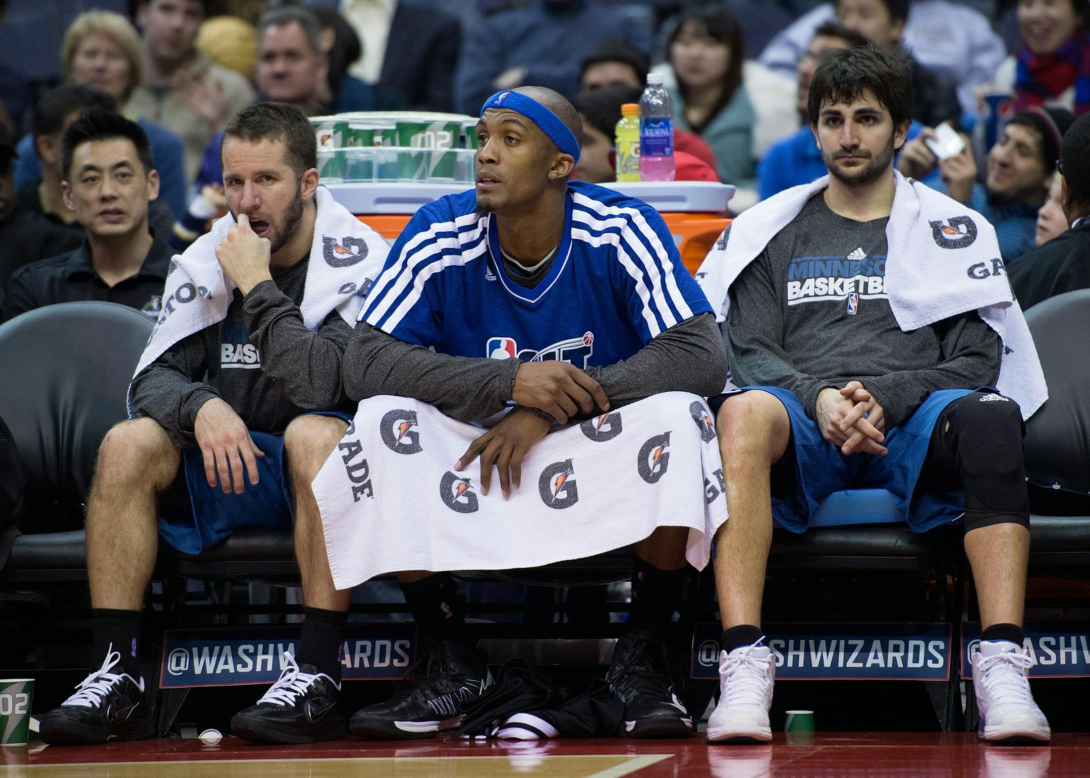 Minnesota Timberwolves point guard J.J. Barea (11), left, Minnesota Timberwolves power forward Dante Cunningham (33) andMinnesota Timberwolves point guard Ricky Rubio (9) watch from the bench late in the second half of their game against the Washington Wizards played at the Verizon Center in Washington, D.C., Friday, January 25, 2013. Washington defeated Minnesota 114-101.