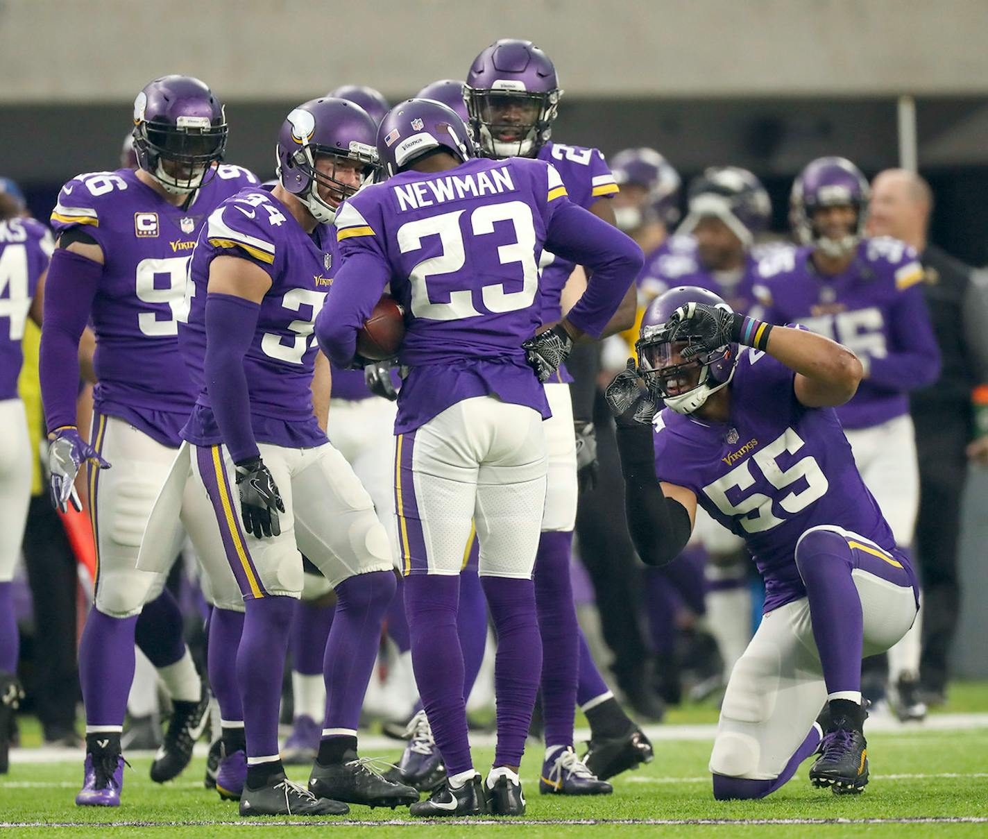 Minnesota Vikings cornerback Terence Newman (23) was congratulated by teammates, including Vikings outside linebacker Anthony Barr (55), who snapped an imaginary photo.