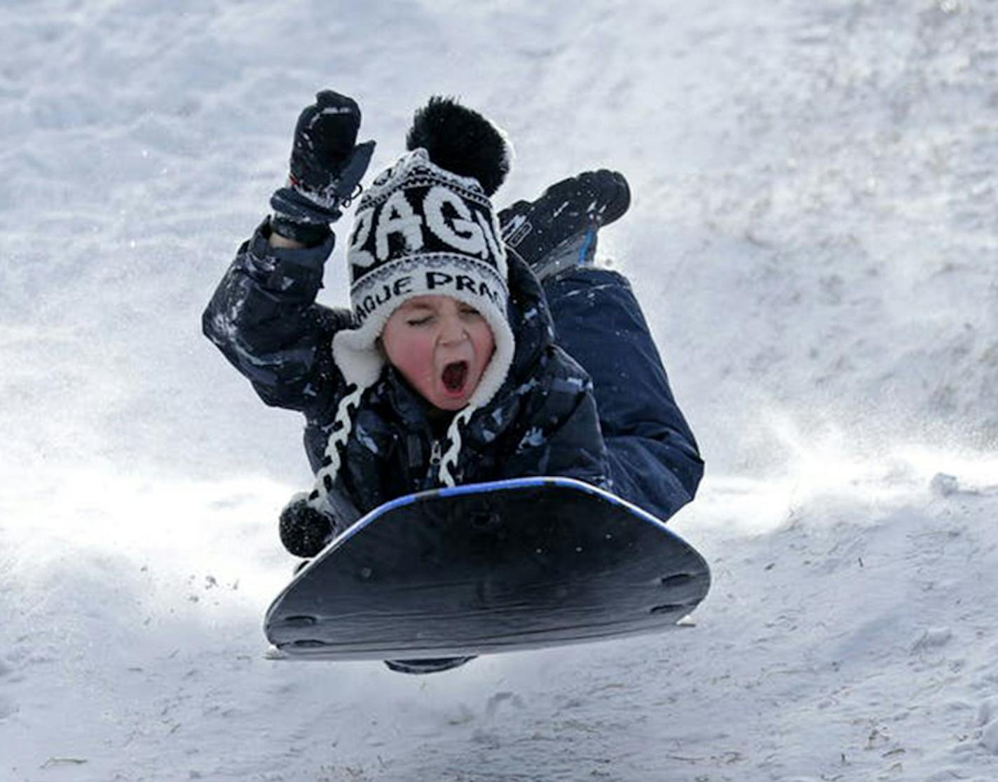 George Inz got some good air while sledding near Minnehaha Creek Monday, Jan. 28, 2019 in Minneapolis, Minn. (Brian Peterson/Star Tribune) ORG XMIT: MIN1901291259423394