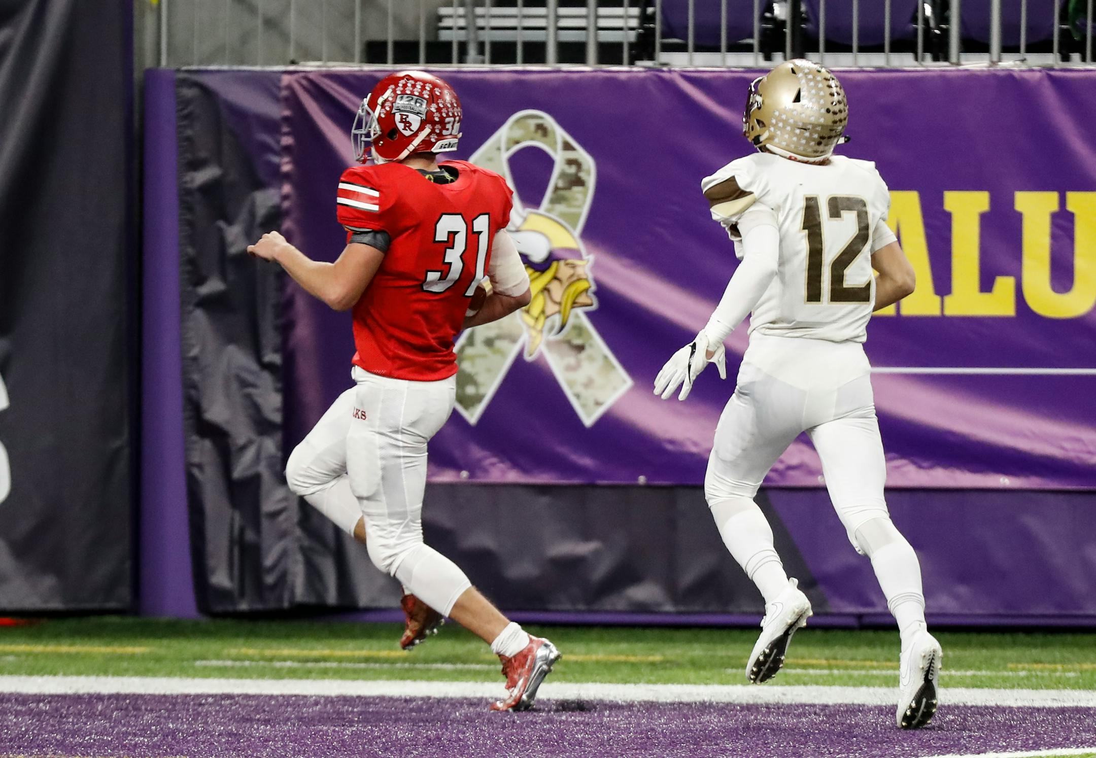 Elk River running back Adam Nelson ran for a 39-yard touchdown during the first half against Apple Valley in the Class 5A semifinals Friday.