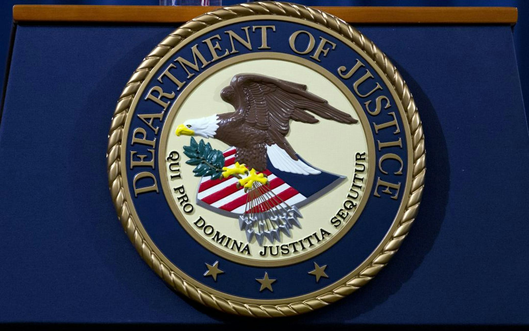 FILE - In this Nov. 28, 2018, file photo, the Department of Justice seal is seen in Washington, D.C.