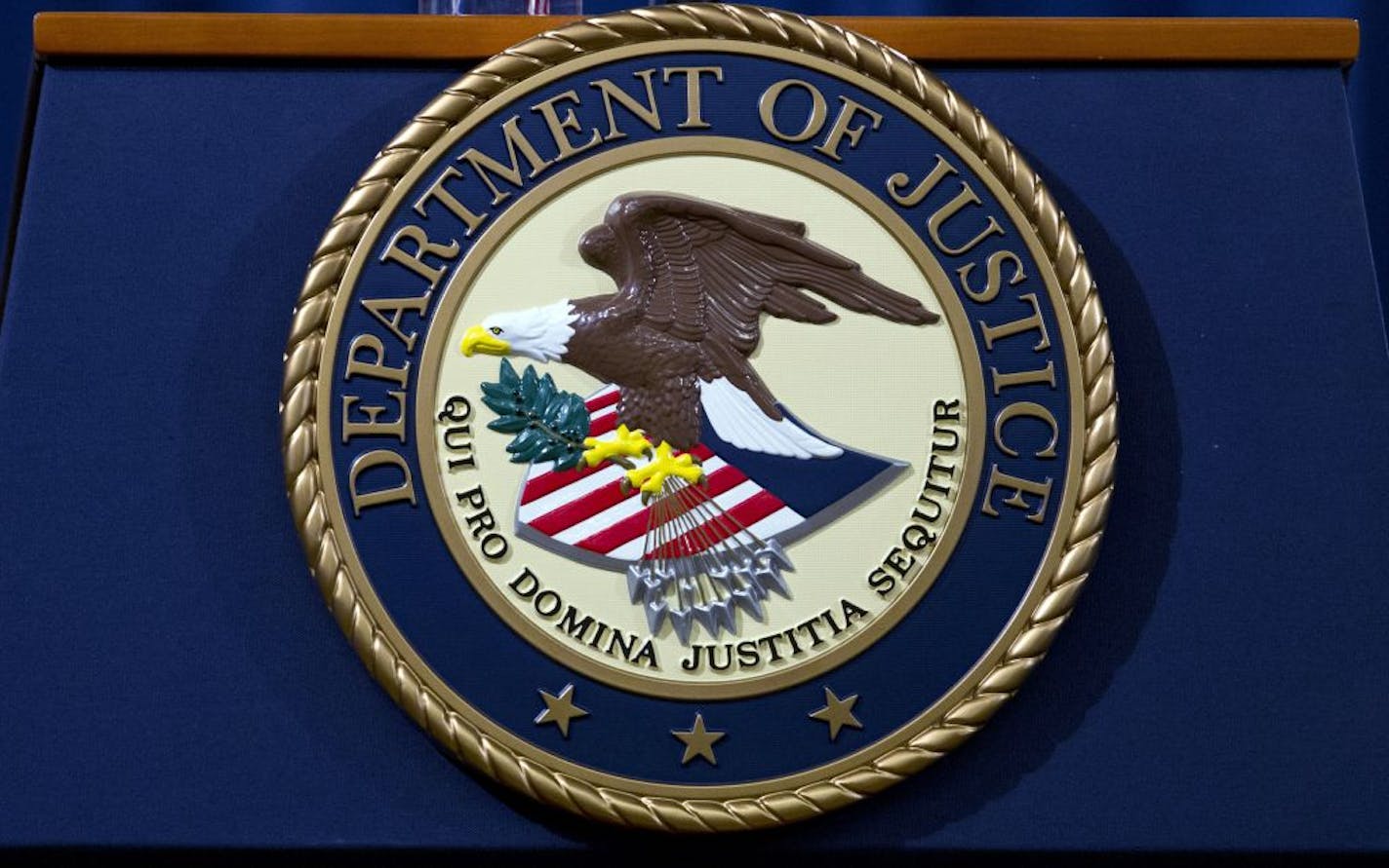 FILE - In this Nov. 28, 2018, file photo, the Department of Justice seal is seen in Washington, D.C.