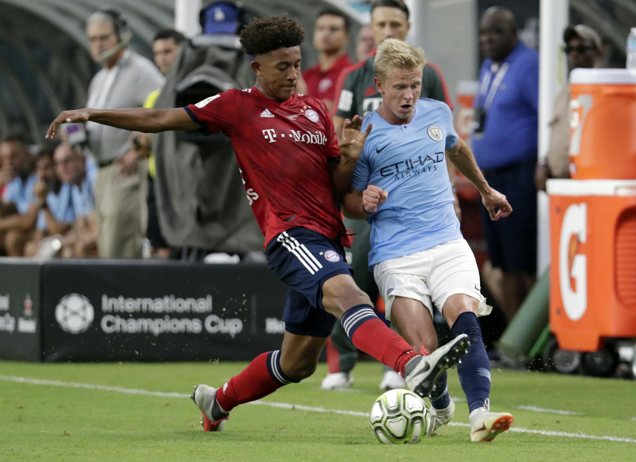 FC Bayern's Chris Richards, left, takes the ball from Manchester City midfielder Oleksandr Zinchenko in a July 2018 International Champions Cup tournament soccer match in Miami Gardens, Fla.