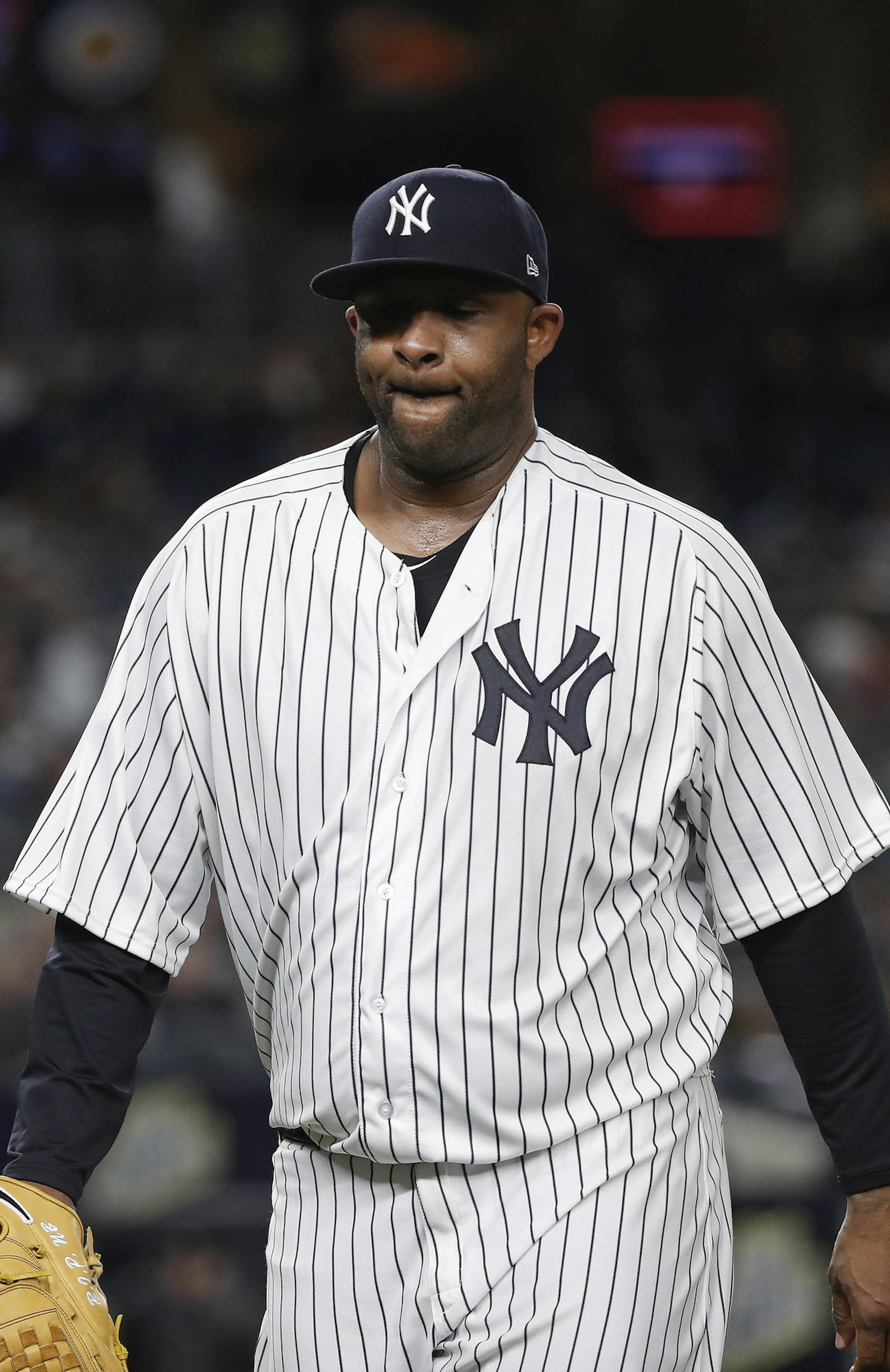 New York Yankees pitcher CC Sabathia walks off the field at the end of the top of the fourth inning of a baseball game against the Baltimore Orioles, Friday, April 6, 2018, in New York. (AP Photo/Julie Jacobson)