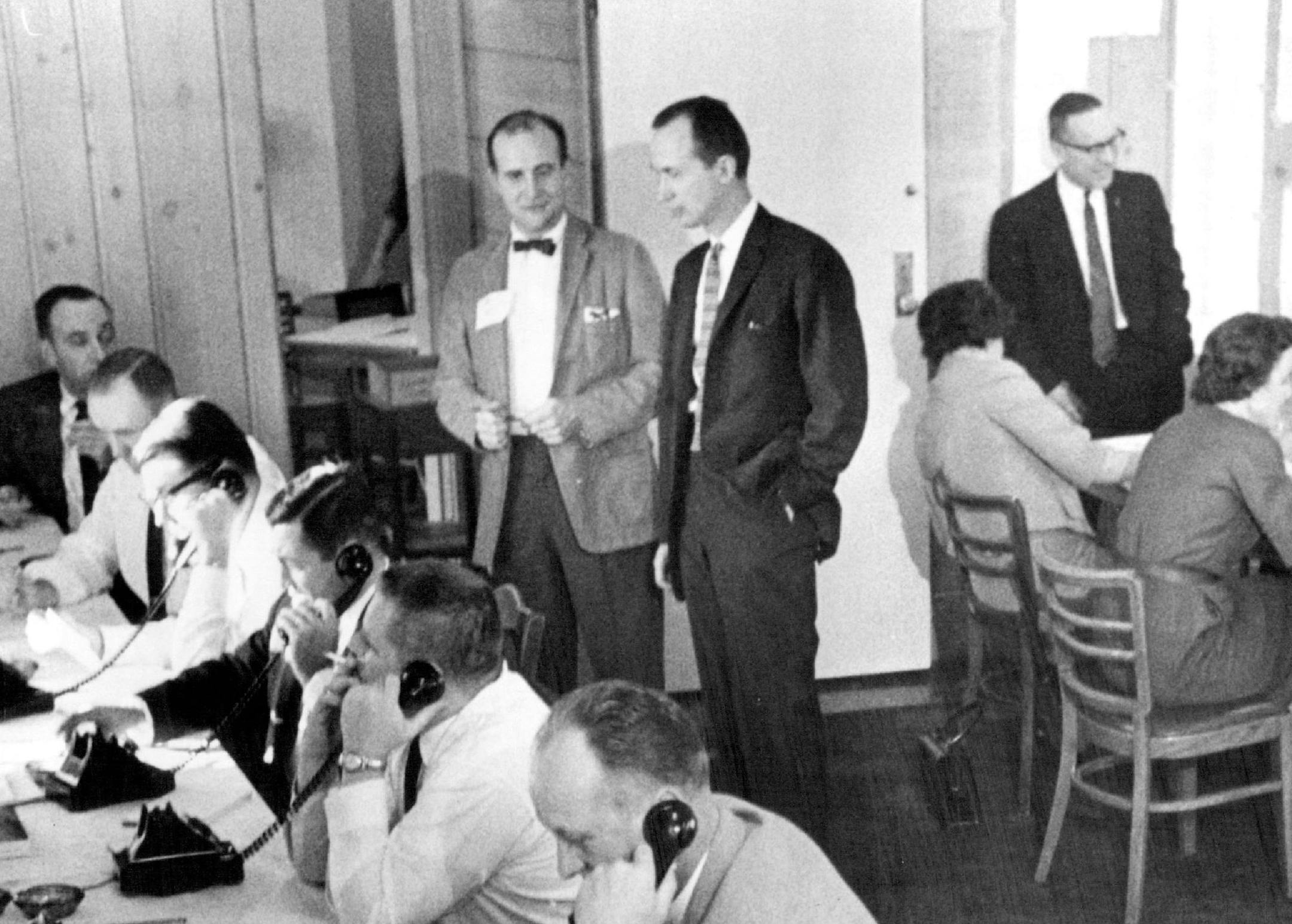 On Dec. 20, 1962, Tom Swain, Gov. Elmer Andersen's recount administrator, stood in a dark suit, center, as the gubernatorial recount carried on around him. The new tally favored Karl Rolvaag — by just 91 votes, or .007% of the votes cast.