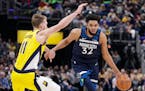 Timberwolves center Karl-Anthony Towns drives around Indiana Pacers forward Domantas Sabonis during a game in January.