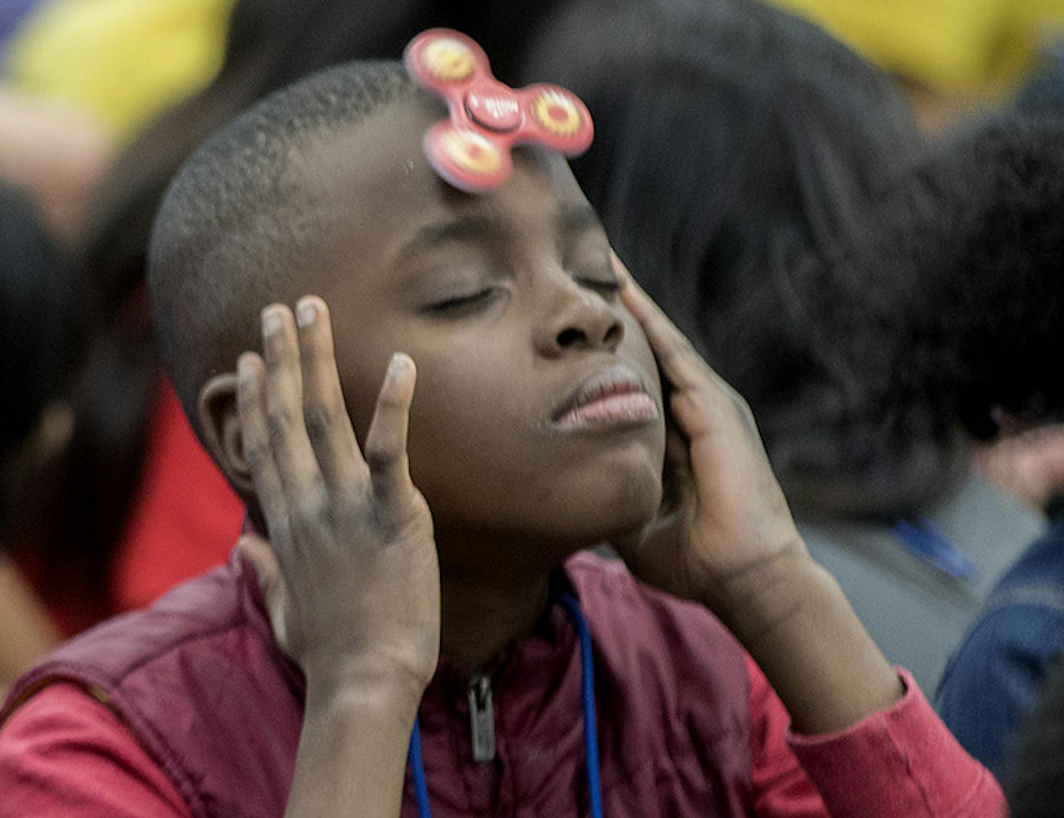 Monroe Elementary School students, consisting of more than 650 students, attempted to set a world record with fidget spinners in the school's gym, Thursday, December 21, 2017 in Brooklyn Park, MN. ] ELIZABETH FLORES ï liz.flores@startribune.com