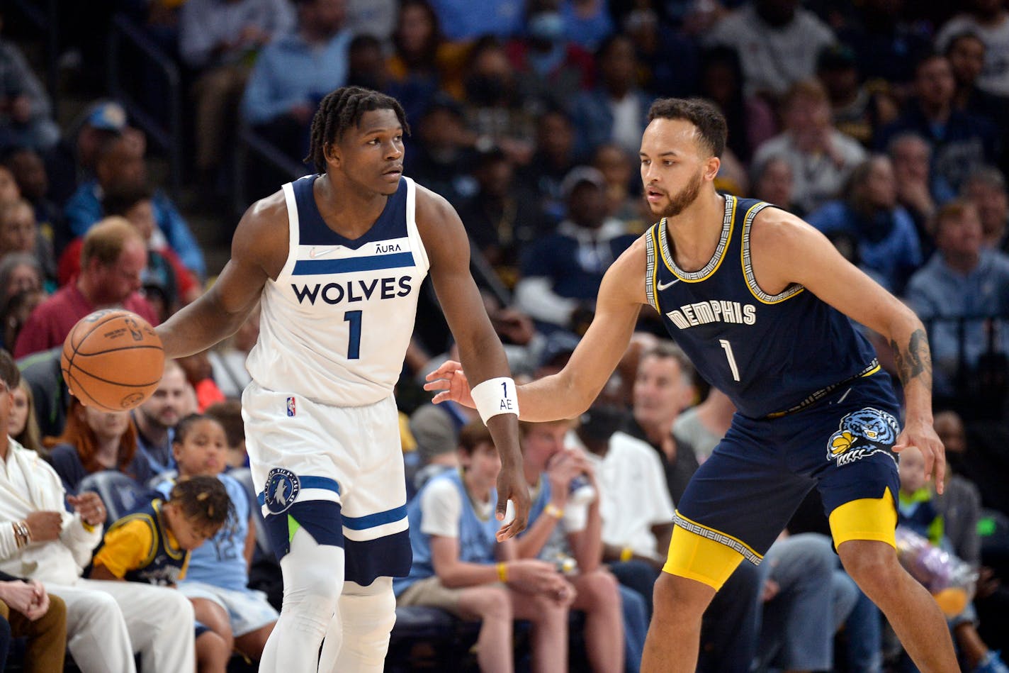 Timberwolves forward Anthony Edwards handled the ball against Grizzlies forward Kyle Anderson. The two are now teammates in Minnesota.