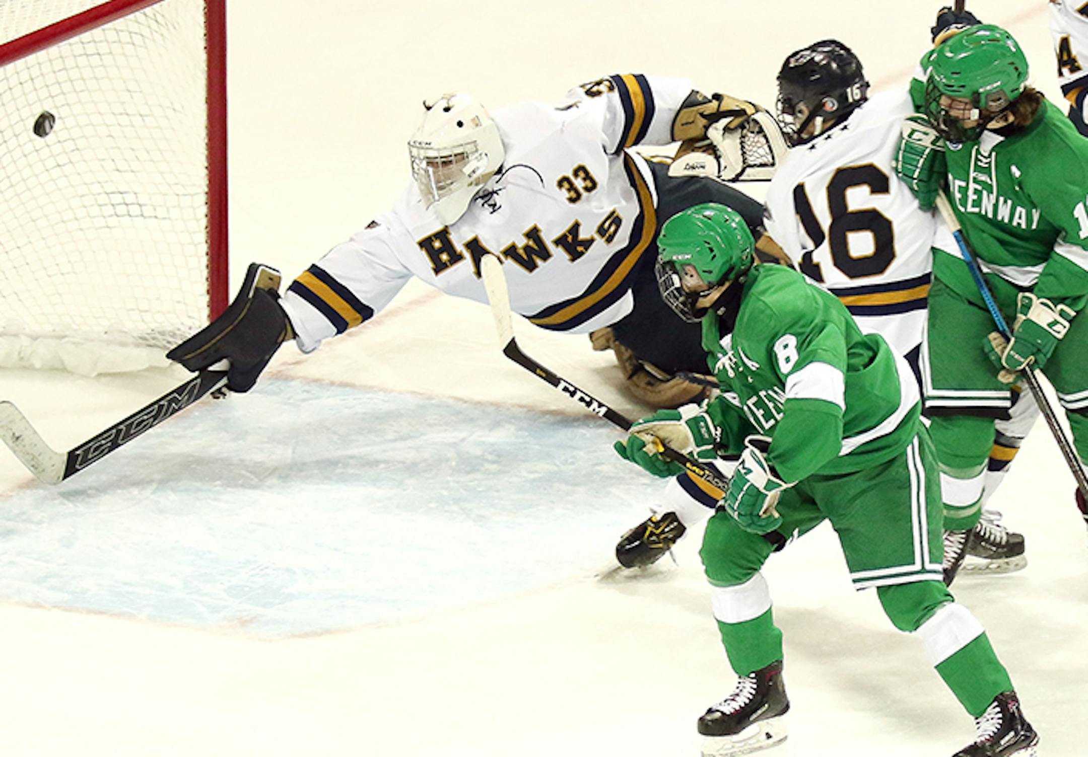 Greenway's Grant Troumbly beats Hermantown goaltender Cole Manahan with a backhand shot during Wednesday night's Section 7A championship game at Amsoil Arena. Photo: Dave Harwig, SportsEngine