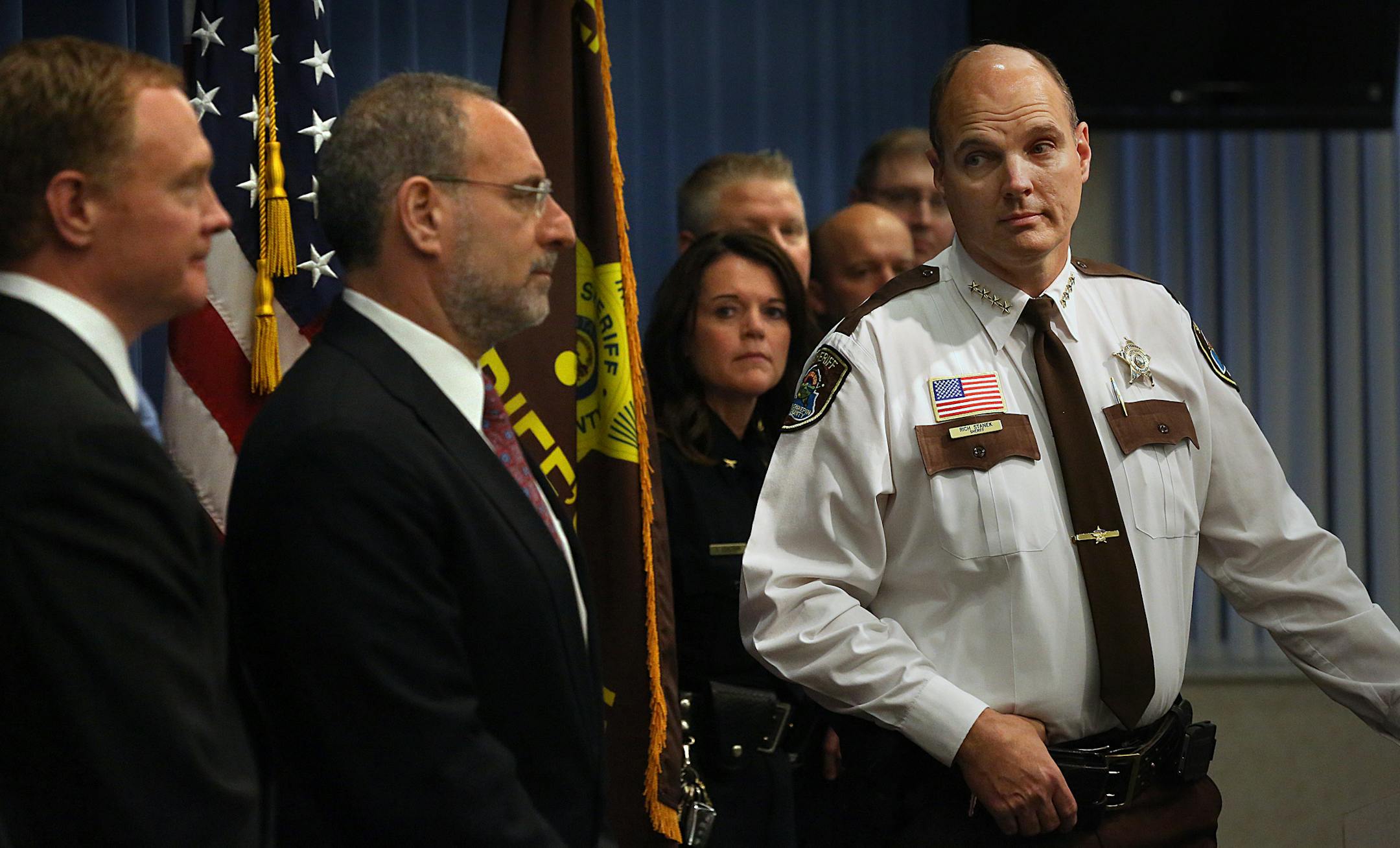Hennepin County Sheriff Richard Stanek (right), deferred a question to U.S. Attorney Andrew Luger (second from left), as Special Agent in Charge ATF-St. Paul Field Division James Modzelewski (left) looked on.