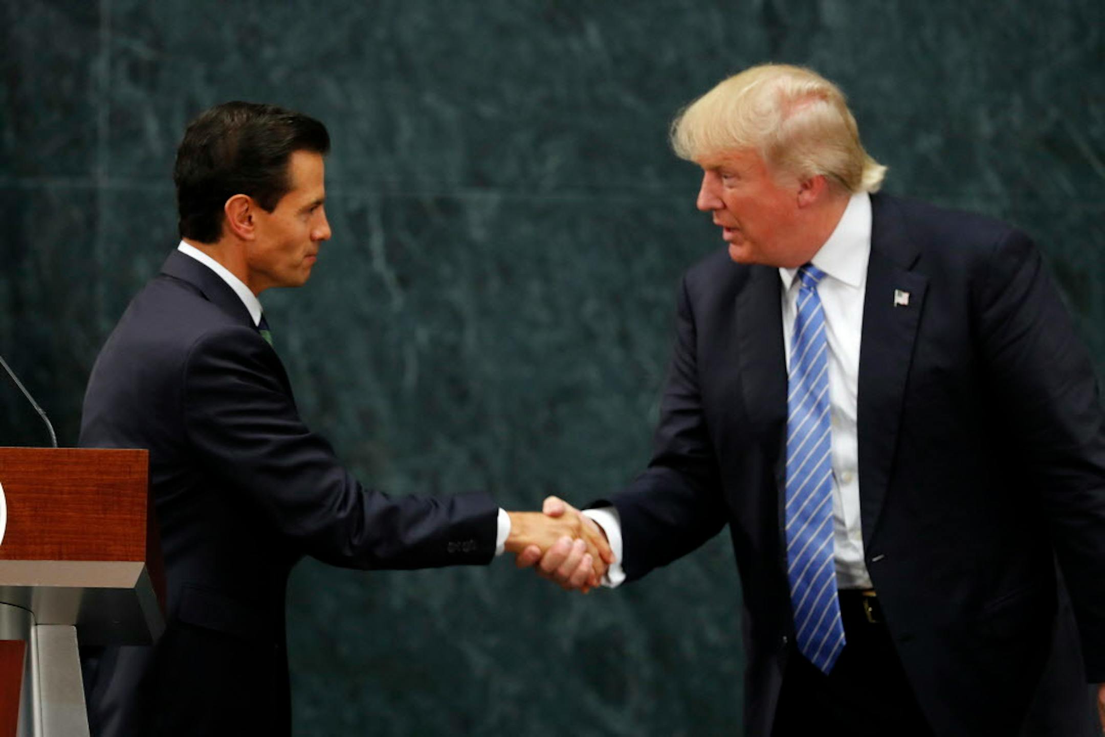Mexico President Enrique Pena Nieto and Republican presidential nominee Donald Trump shake hands after a joint statement at Los Pinos, the presidential official residence, in Mexico City, Wednesday, Aug. 31, 2016. Trump is calling his surprise visit to Mexico City Wednesday a 'great honor.' The Republican presidential nominee said after meeting with Pena Nieto that the pair had a substantive, direct and constructive exchange of ideas.(AP Photo/Dario Lopez-Mills)