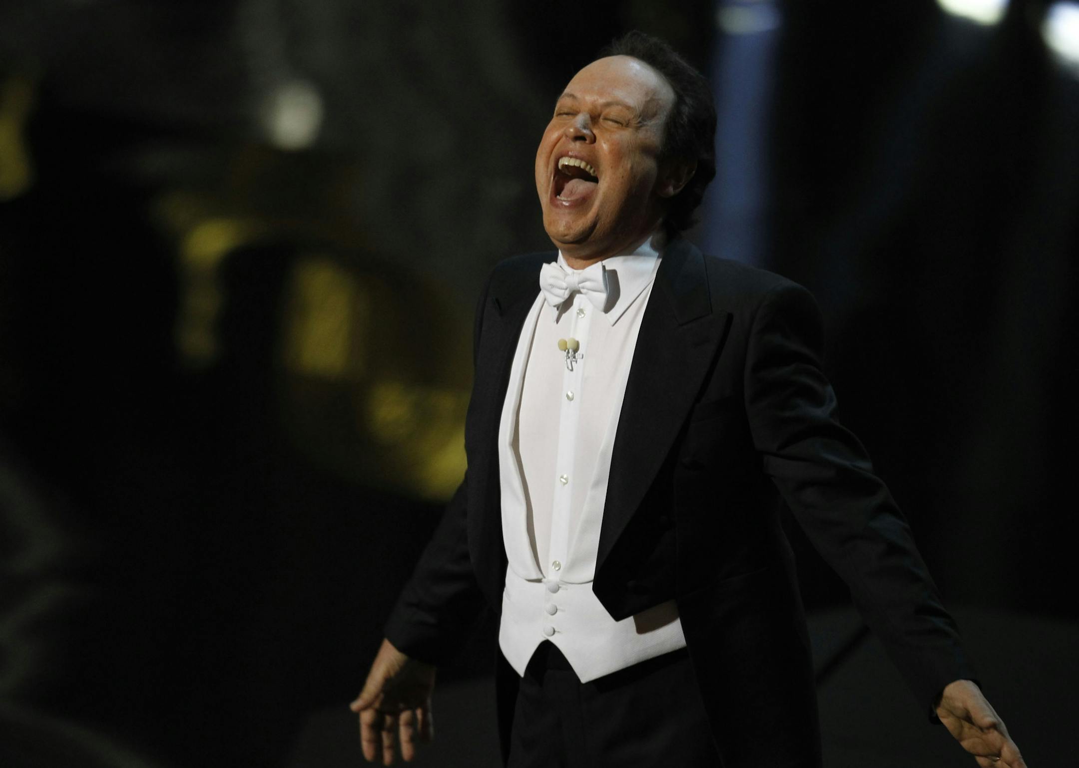 Billy Crystal opens the 84th Annual Academy Awards show at the Hollywood and Highland Center in Los Angeles, California, on Sunday, February 26, 2012.