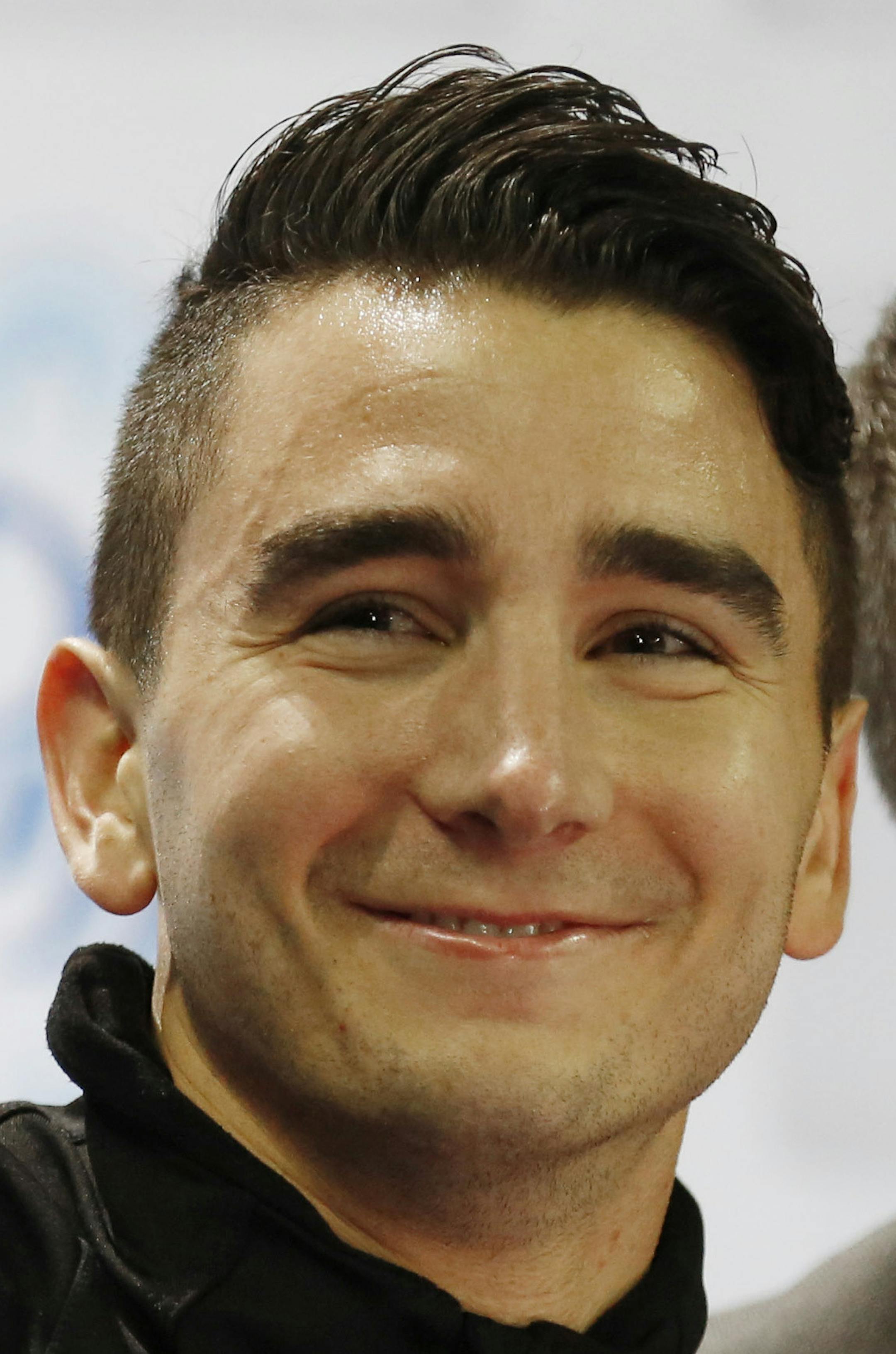 Max Aaron points to the crowd after his score for the short program at the Skate America figure skating competition Friday, Oct. 23, 2015, in Milwaukee. (AP Photo/Jeffrey Phelps) ORG XMIT: WIJP175