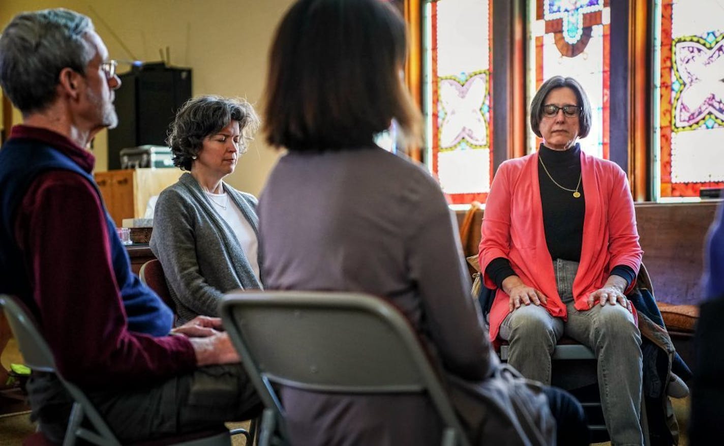 Members of prayer group that meets four days a week gather for what they call centering prayer, silent prayer/contemplation in the church sanctuary of First United Church of Christ. Marian McKone, right, led the group.