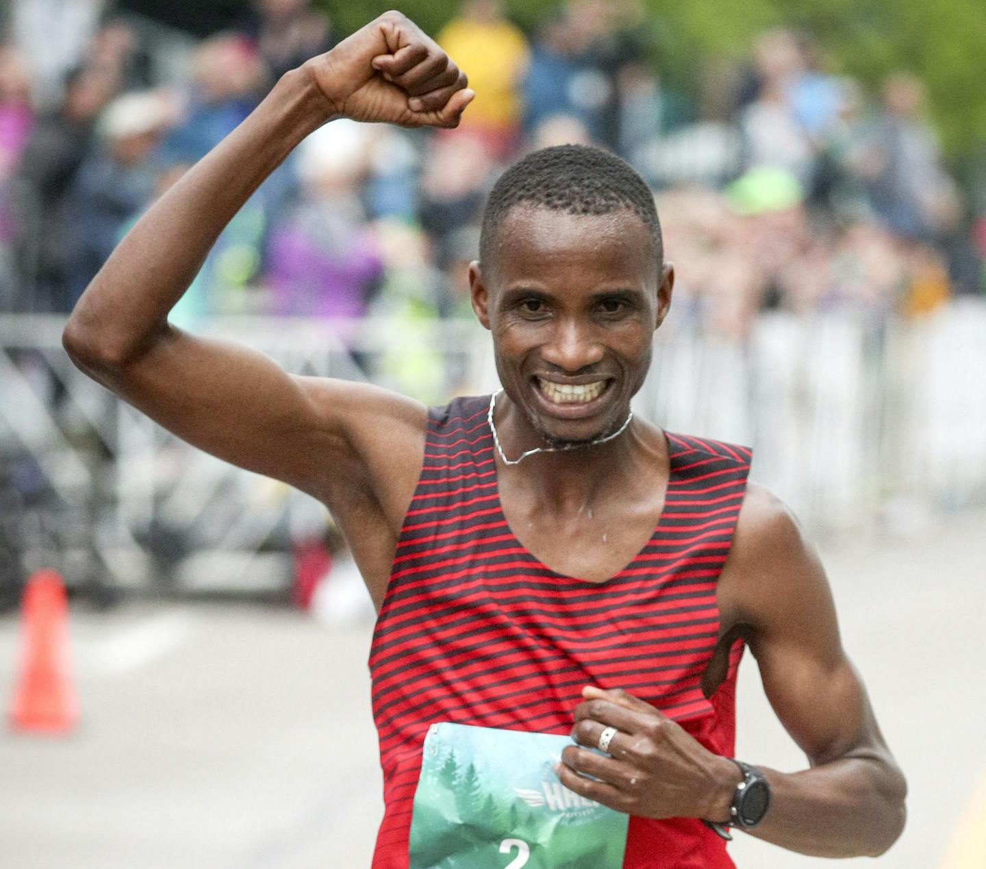 t061618 --- Clint Austin --- 061718.N.DNT.GMAS.C45 --- Panuel Mkungo of Elkton, MD. celebrates while crossing the finish line of the Garry Bjorklund Half Marathon in the Canal Park neighborhood of Duluth Saturday morning. Mkungo was the overall winner with a time of 1:02:50.--- Clint Austin / caustin@duluthnews.com