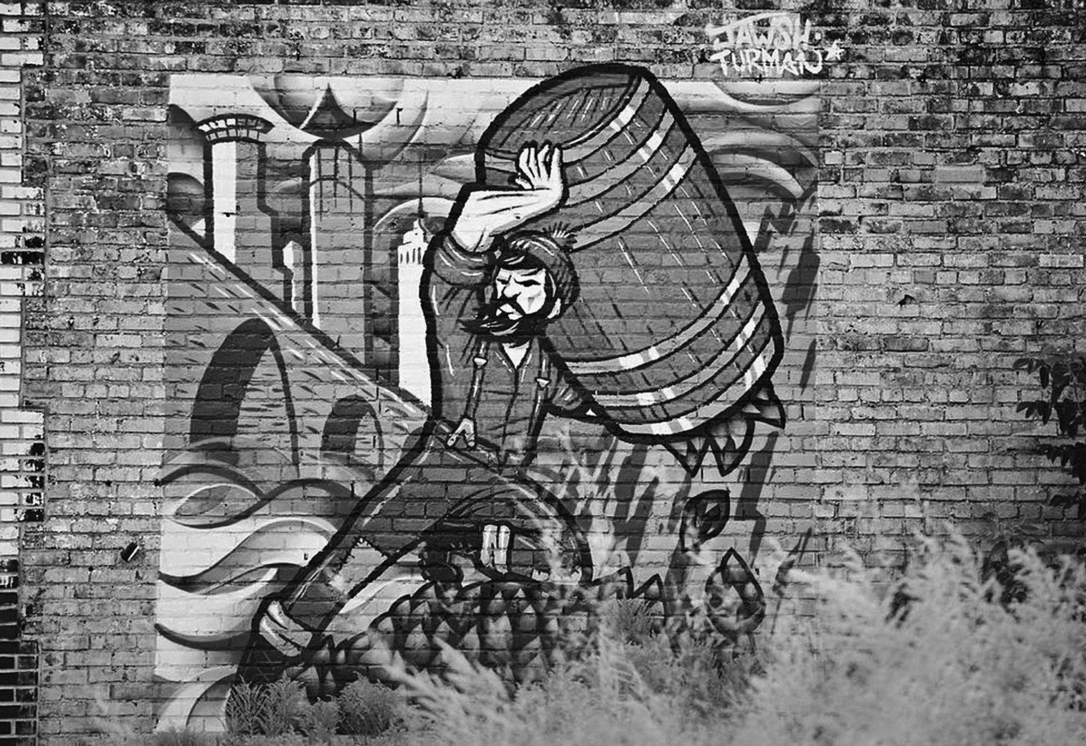 Adam Turman painted this Sisyphus Brewery mural, which faces the I-394/94 interchange in Minneapolis.