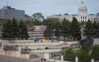 Tents were set up on cement stairs between the History Center and Catholic Charities and in the shadow of the state capitol building in St. Paul on Th