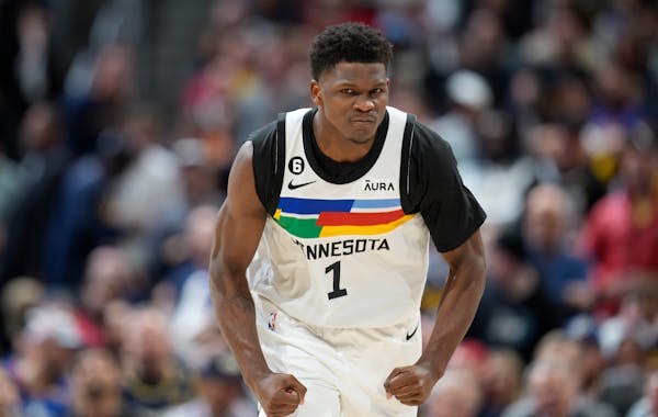 Minnesota Timberwolves guard Anthony Edwards reacts after hitting a 3-point basket against the Denver Nuggets during the second half of Game 2 of an N