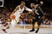 Minnesota's Isaiah Washington (11) drives the ball around Nebraska-Omaha's KJ Robinson (5) during an NCAA college basketball game Tuesday, Nov. 6, 201