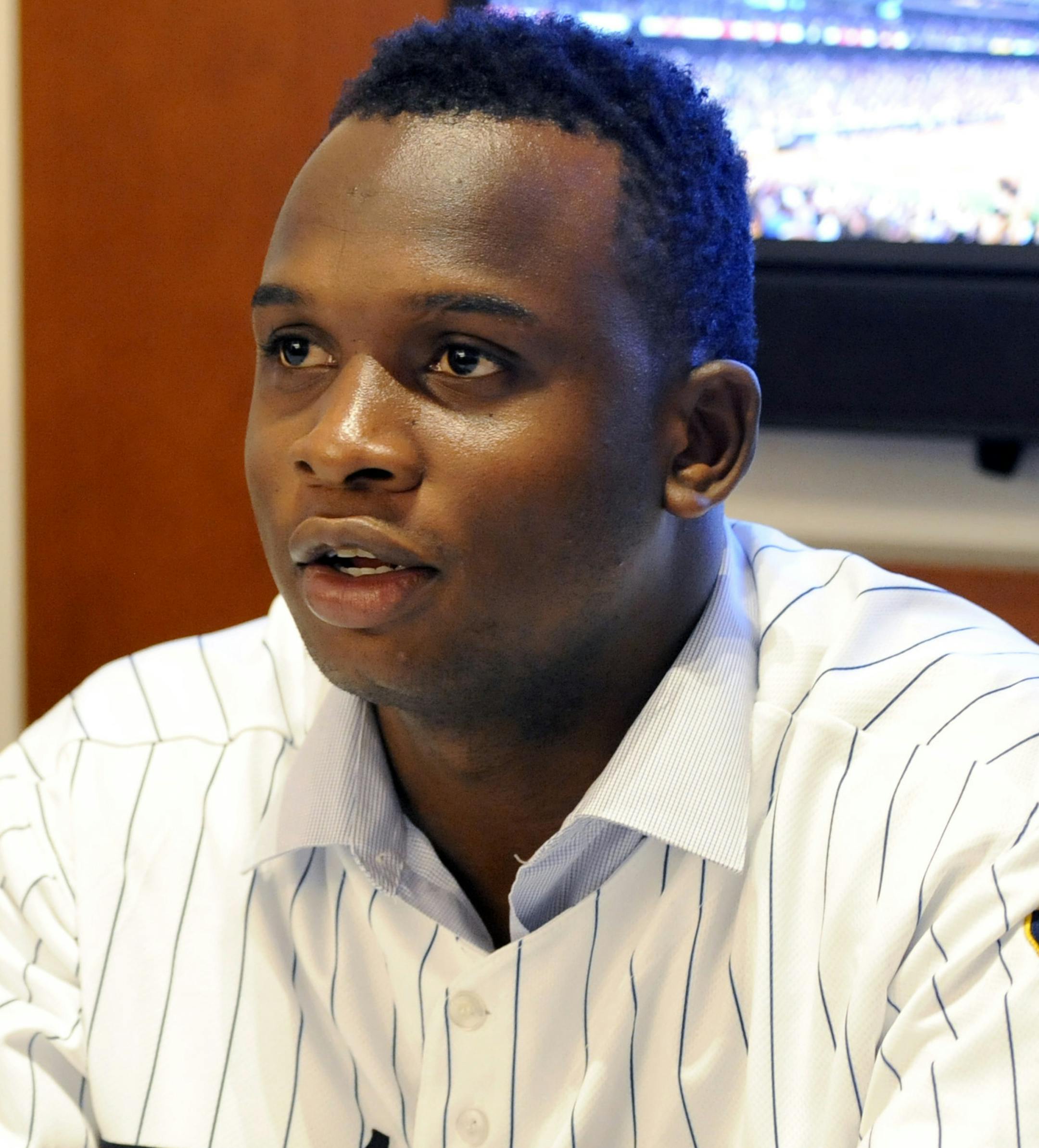 Minnesota Twins prospect Miguel Sano signs an autograph for a fan during the baseball team's TwinsFest at Target Field on Friday, Jan. 24, 2014, in Minneapolis. (AP Photo/Hannah Foslien) ORG XMIT: MIN2014021501432524