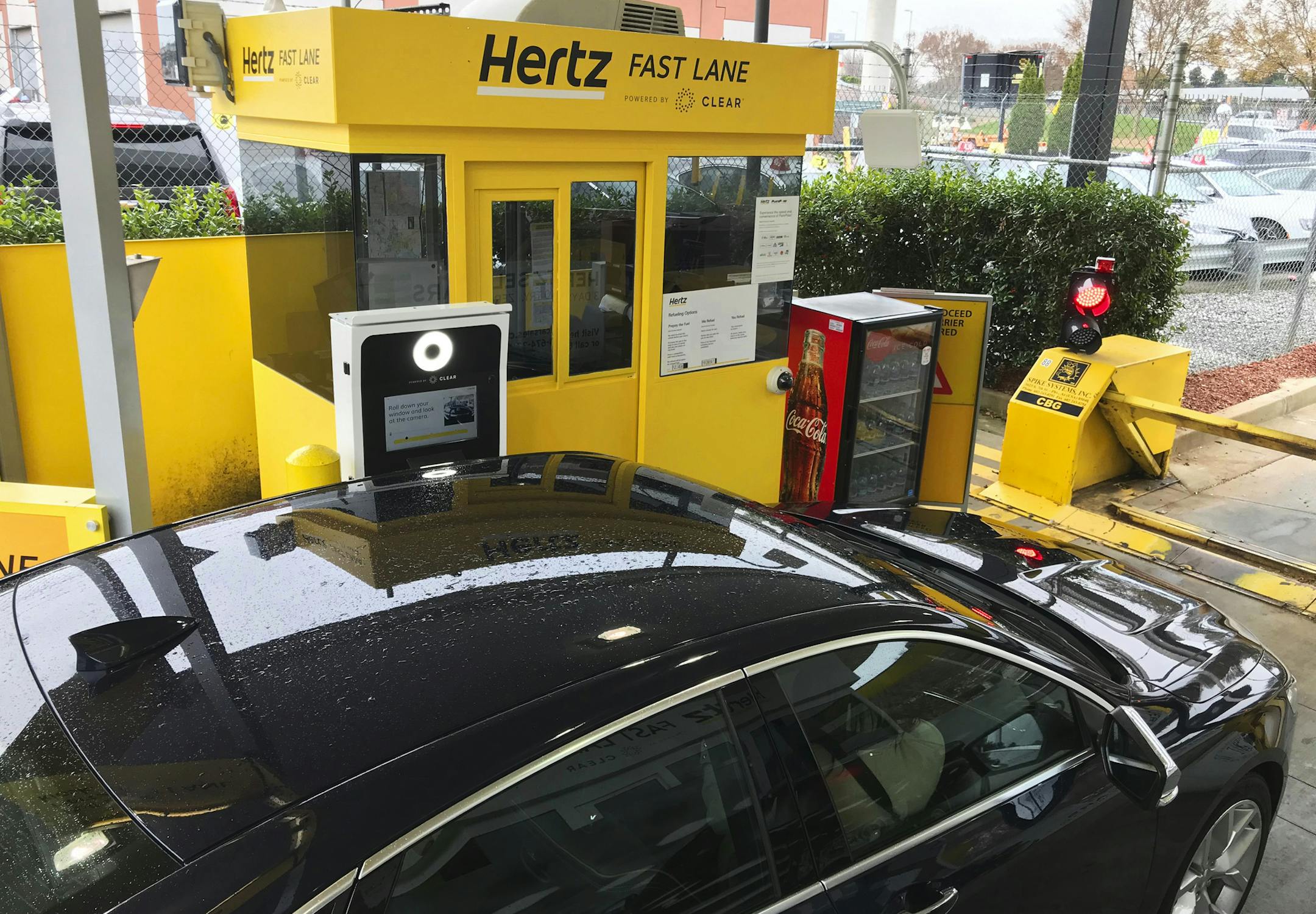 In this Friday, Dec. 7, 2018, photo, a rental car approaches a biometric scanning machine at the exit of the Hertz facility at Hartsfield-Jackson Atlanta International Airport, in Atlanta.